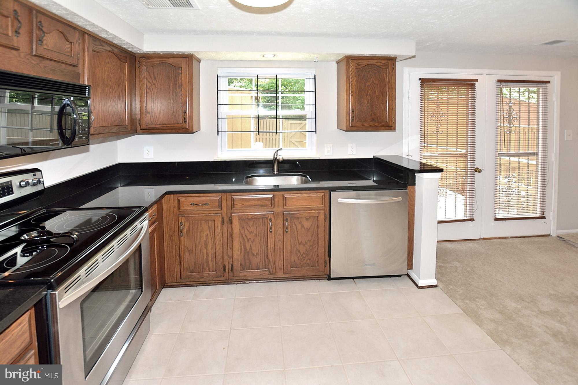 7475 Lone Star Road Lorton, VA 22079 - Photo 4 of 22 Updated kitchen with tile flooring
