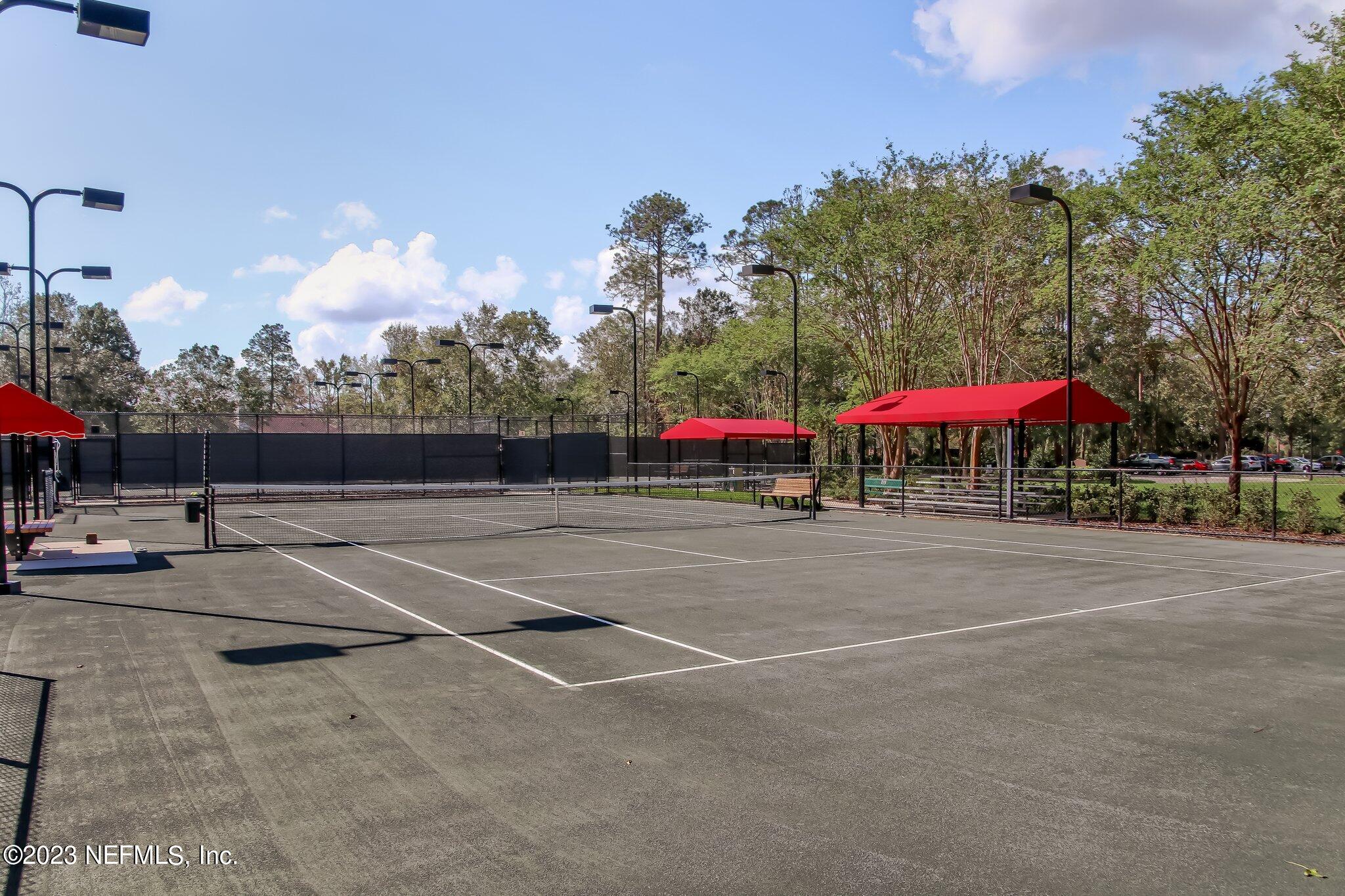2011 Salt Myrtle Lane Fleming Island, FL 32003 - Photo 105 of 124 a view of a tennis ground with large trees