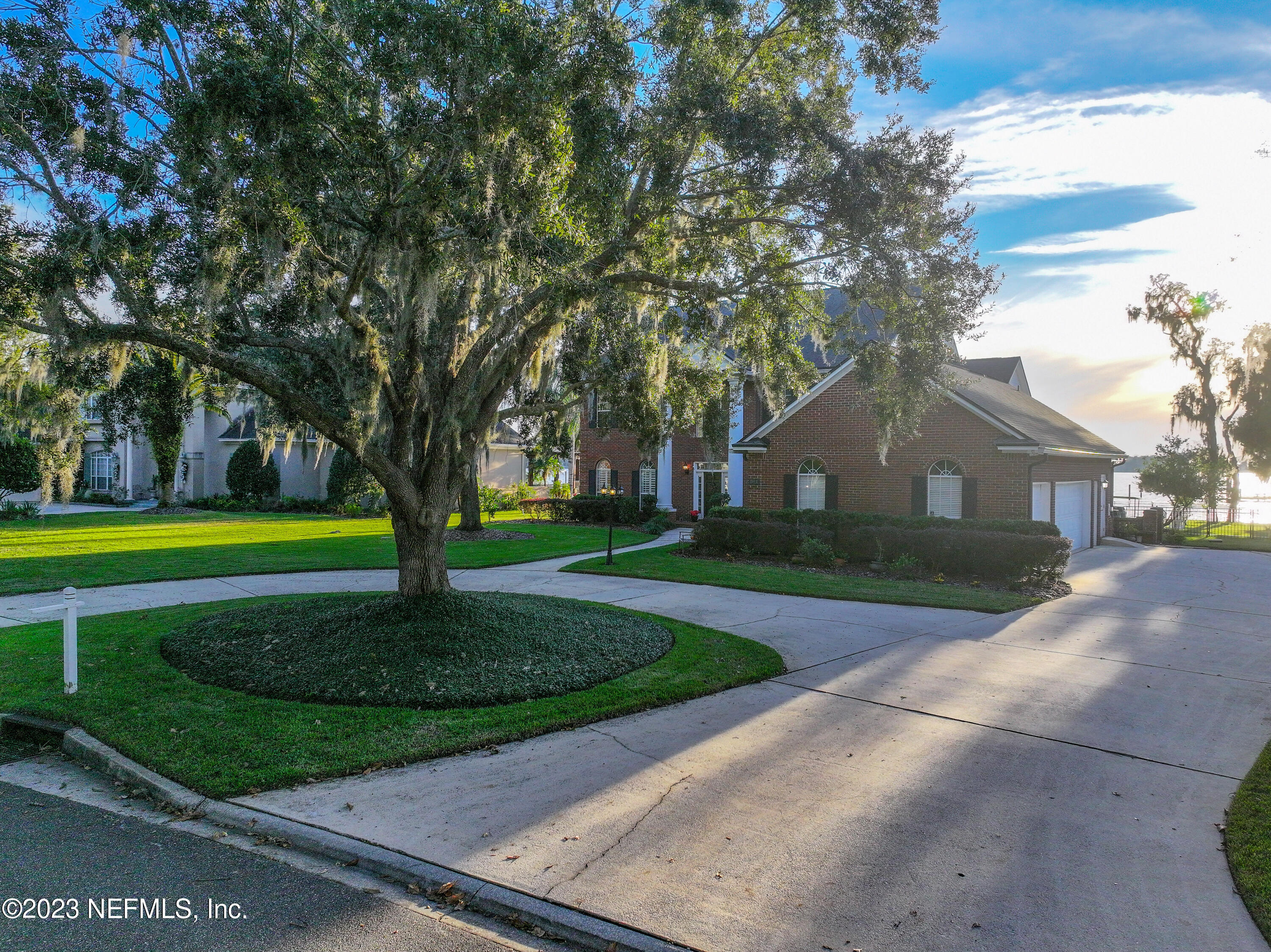2011 Salt Myrtle Lane Fleming Island, FL 32003 - Photo 114 of 124 a view of a house with a big yard plants and large trees