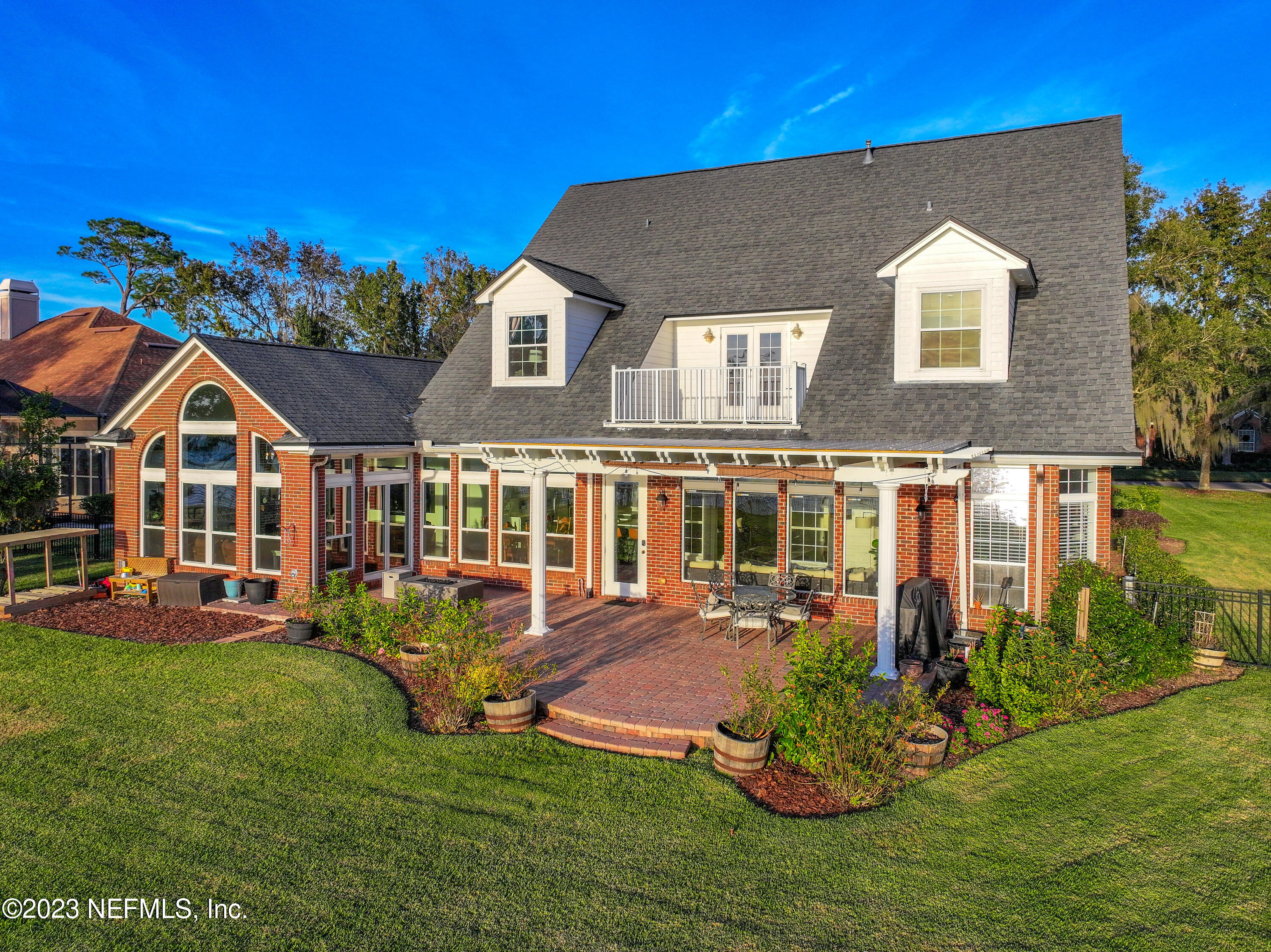 2011 Salt Myrtle Lane Fleming Island, FL 32003 - Photo 122 of 124 a front view of a house with a yard