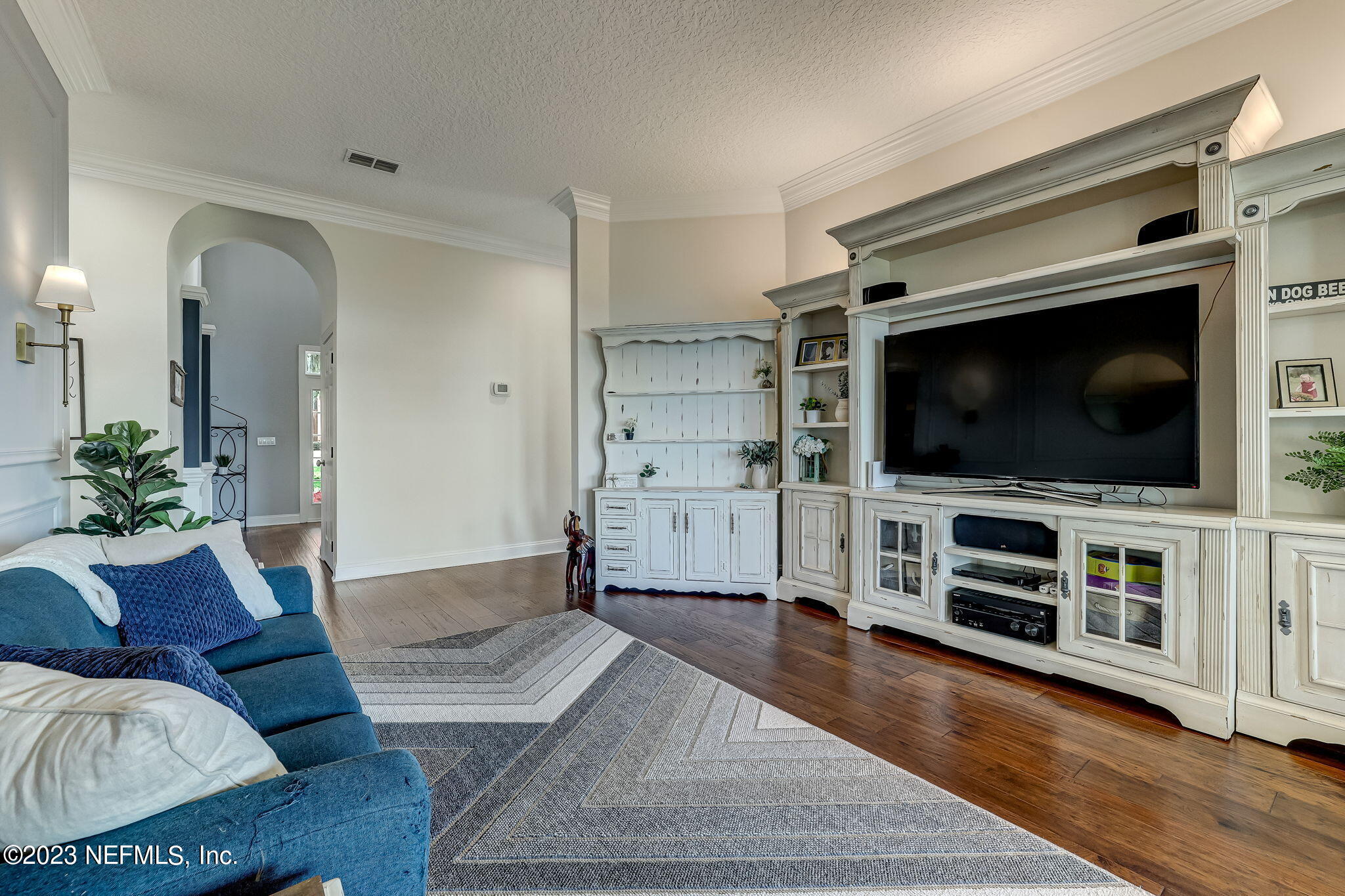 2011 Salt Myrtle Lane Fleming Island, FL 32003 - Photo 18 of 124 a living room with furniture and a flat screen tv