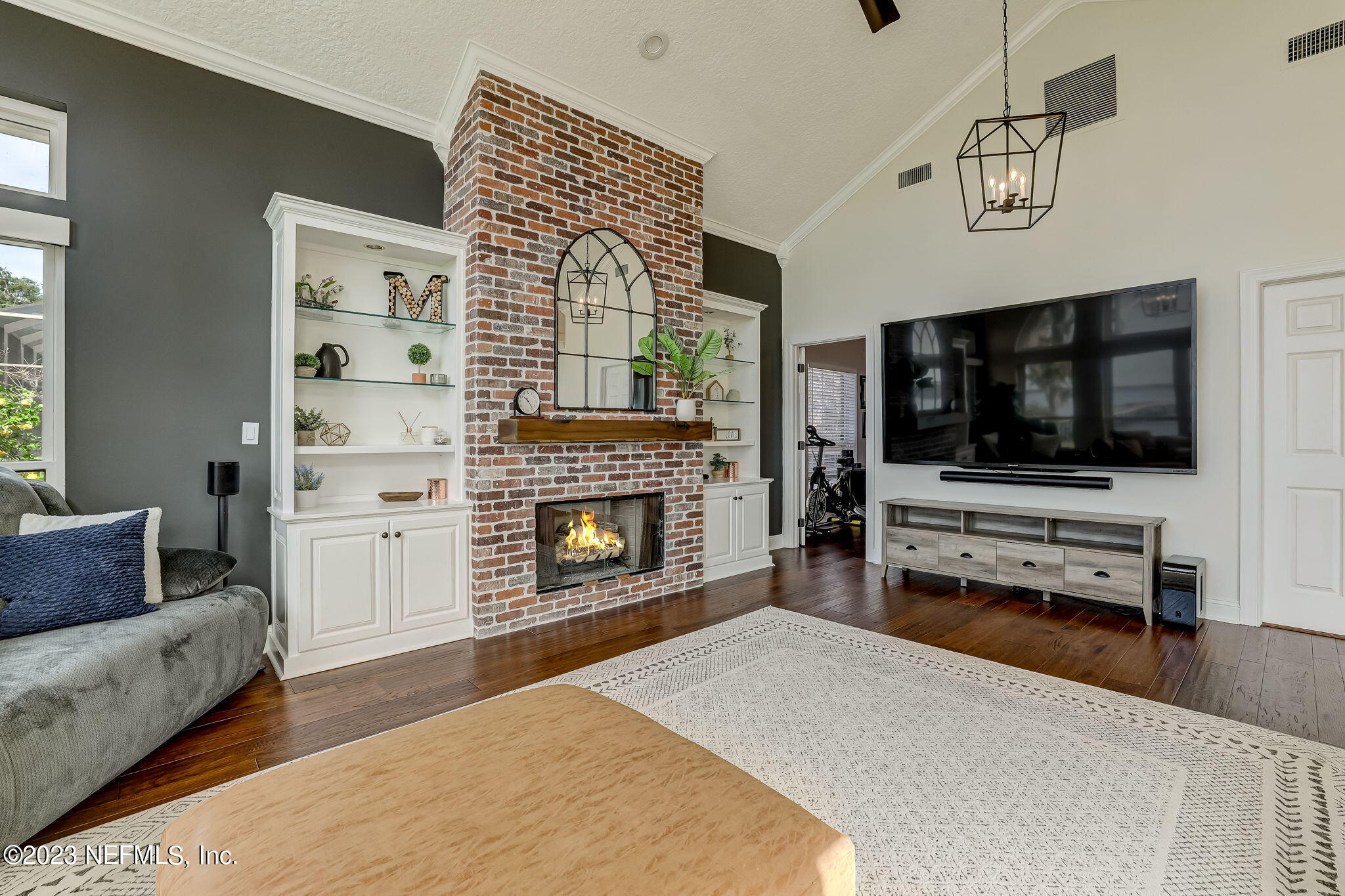 2011 Salt Myrtle Lane Fleming Island, FL 32003 - Photo 22 of 124 a living room with furniture and a flat screen tv