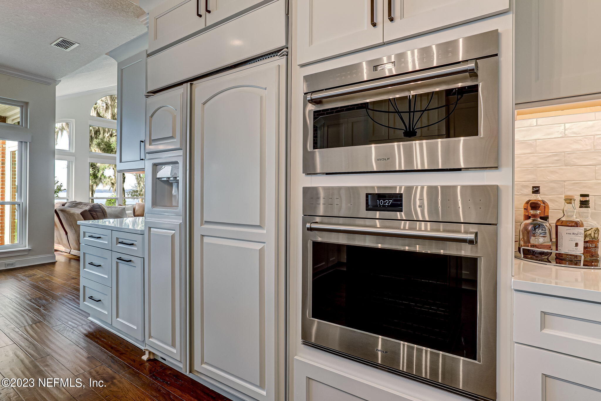 2011 Salt Myrtle Lane Fleming Island, FL 32003 - Photo 29 of 124 a kitchen with stainless steel appliances a stove a microwave and a refrigerator