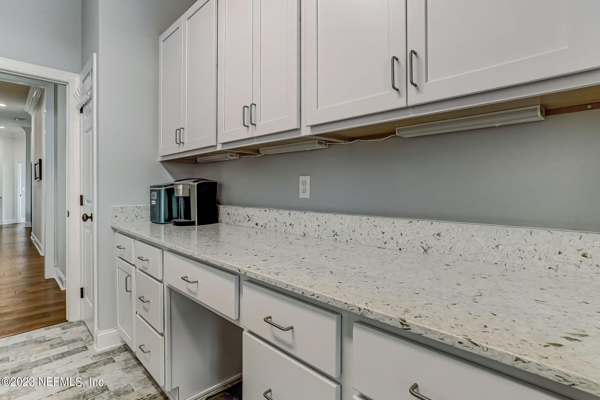 2011 Salt Myrtle Lane Fleming Island, FL 32003 - Photo 31 of 124 a kitchen with granite countertop white cabinets and a sink