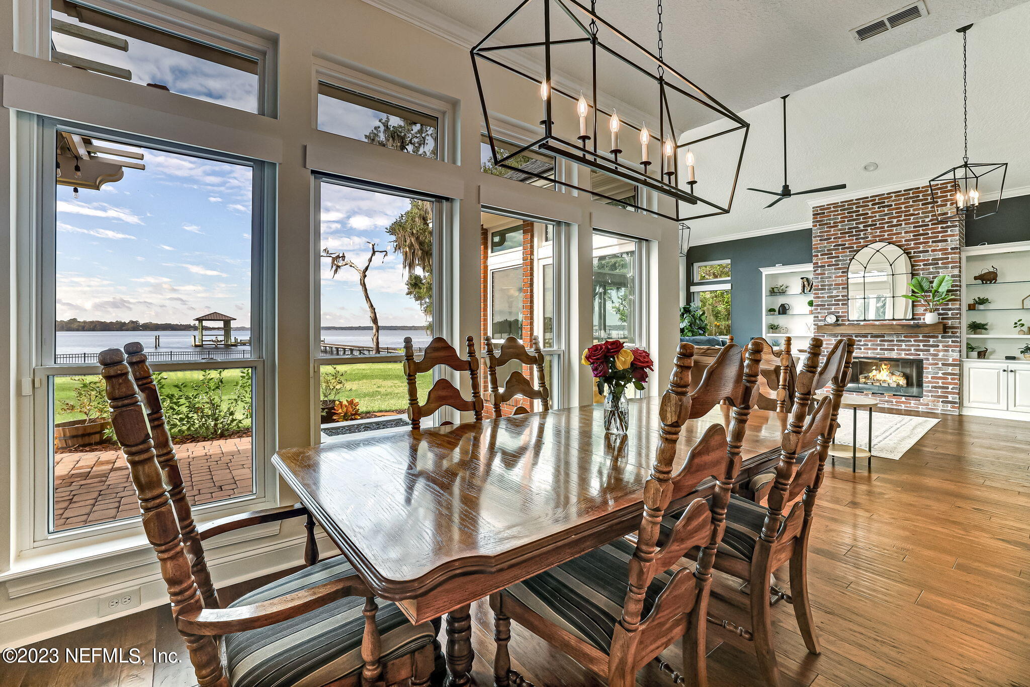 2011 Salt Myrtle Lane Fleming Island, FL 32003 - Photo 32 of 124 a view of a dining room with furniture wooden floor and chandelier