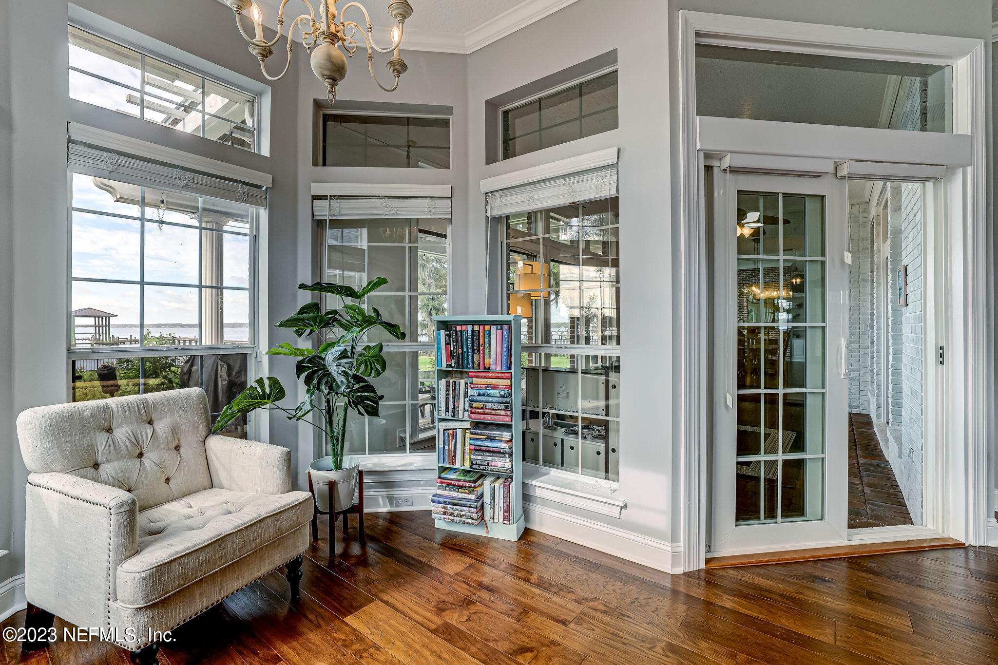 2011 Salt Myrtle Lane Fleming Island, FL 32003 - Photo 39 of 124 a living room with furniture and a large window