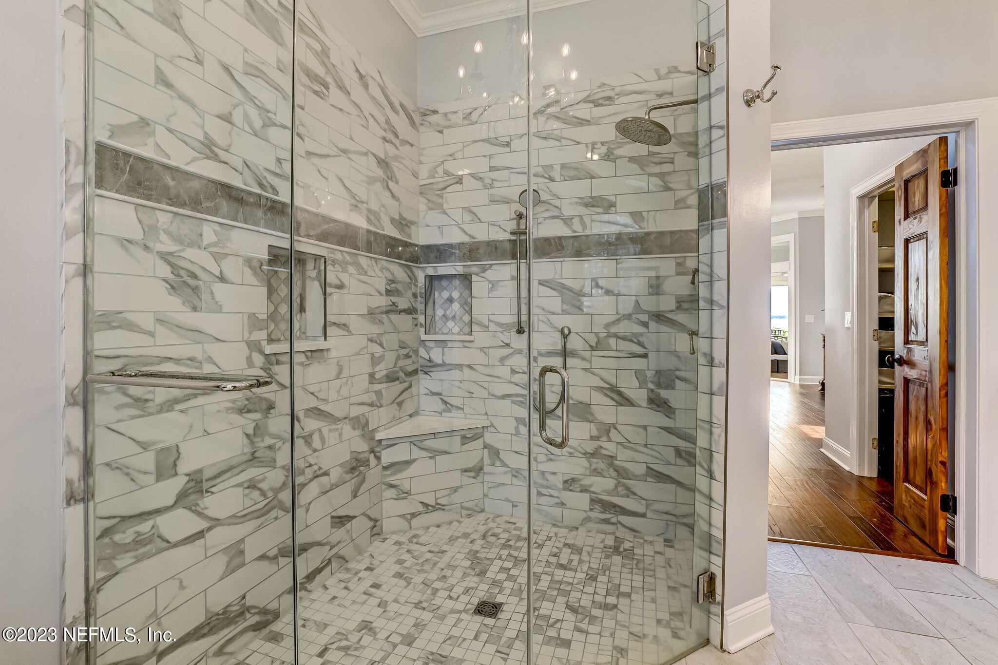 2011 Salt Myrtle Lane Fleming Island, FL 32003 - Photo 42 of 124 a bathroom with a shower and a glass door