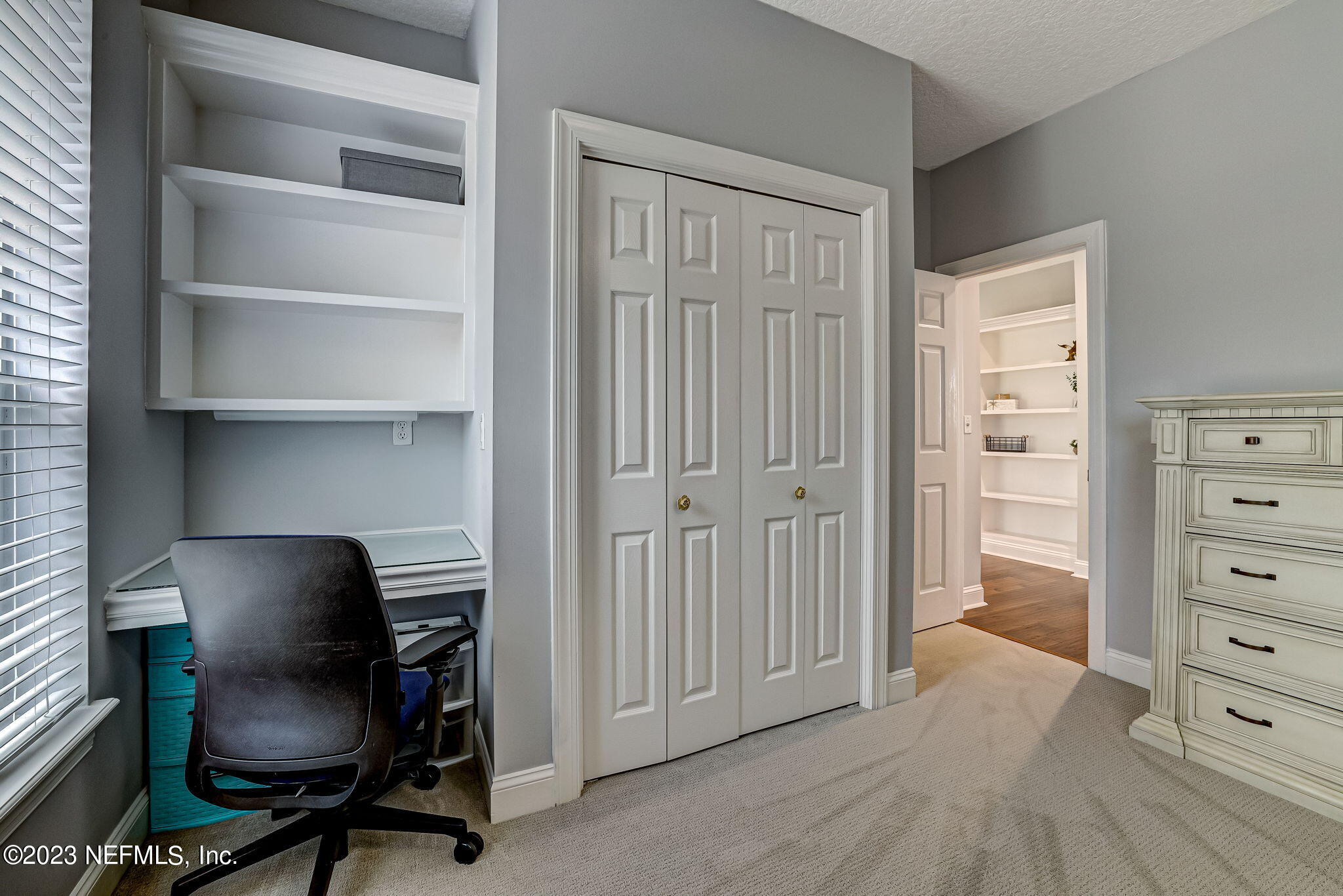 2011 Salt Myrtle Lane Fleming Island, FL 32003 - Photo 58 of 124 a view of a workspace with furniture and a dresser