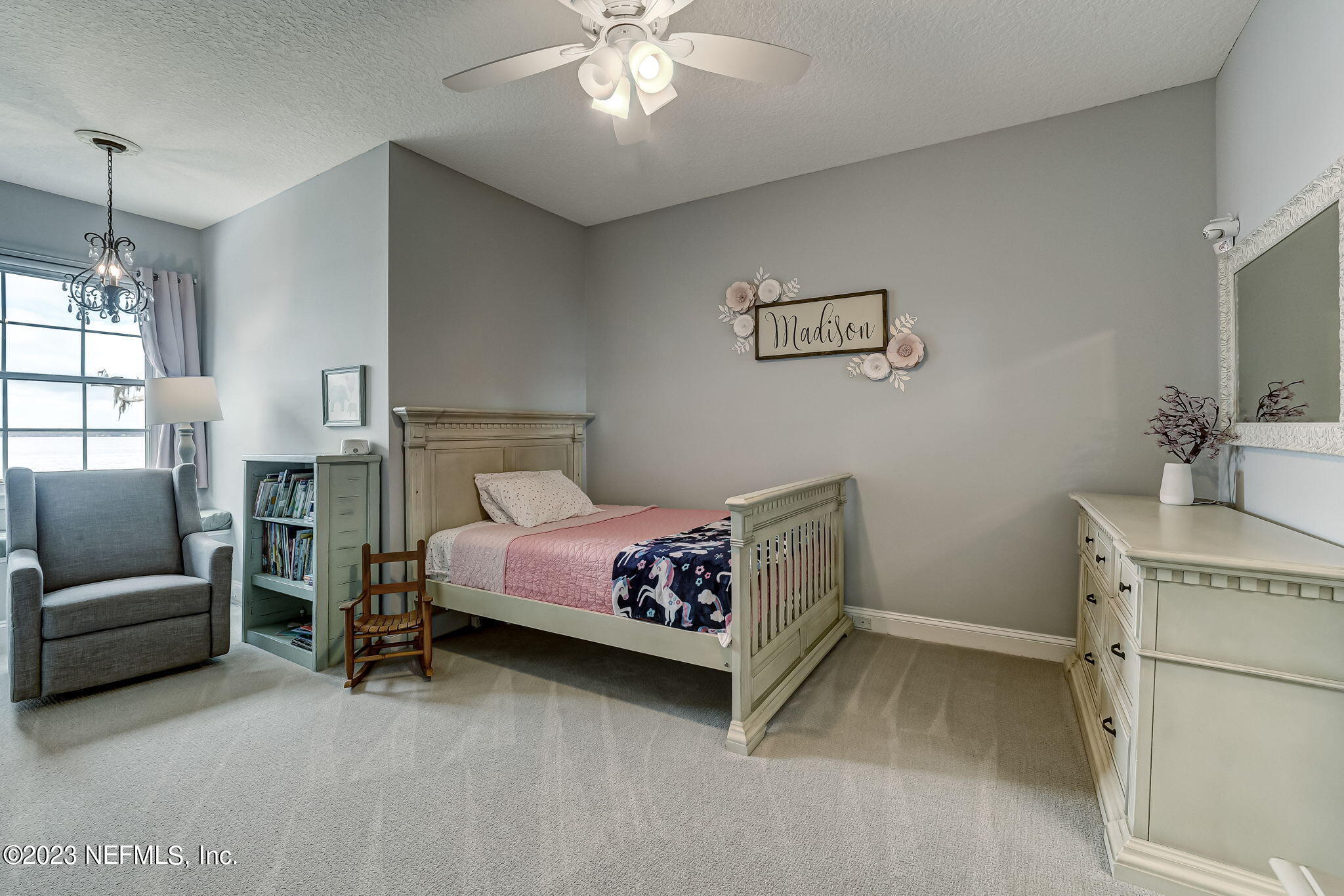 2011 Salt Myrtle Lane Fleming Island, FL 32003 - Photo 61 of 124 a bedroom with a bed and a couch