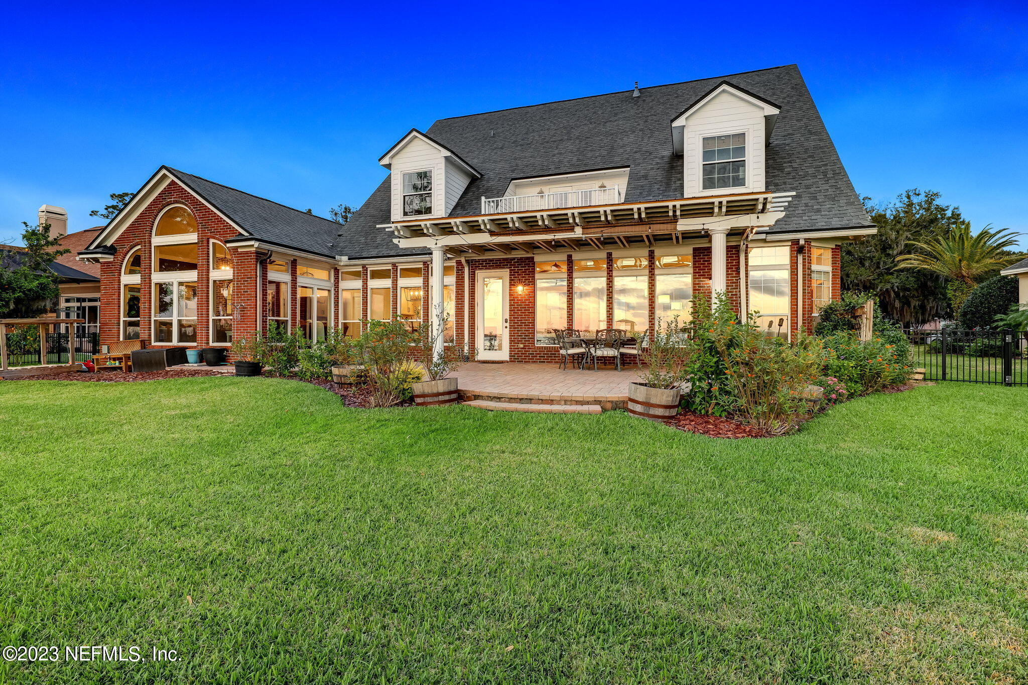 2011 Salt Myrtle Lane Fleming Island, FL 32003 - Photo 87 of 124 a front view of a house with a yard and garage