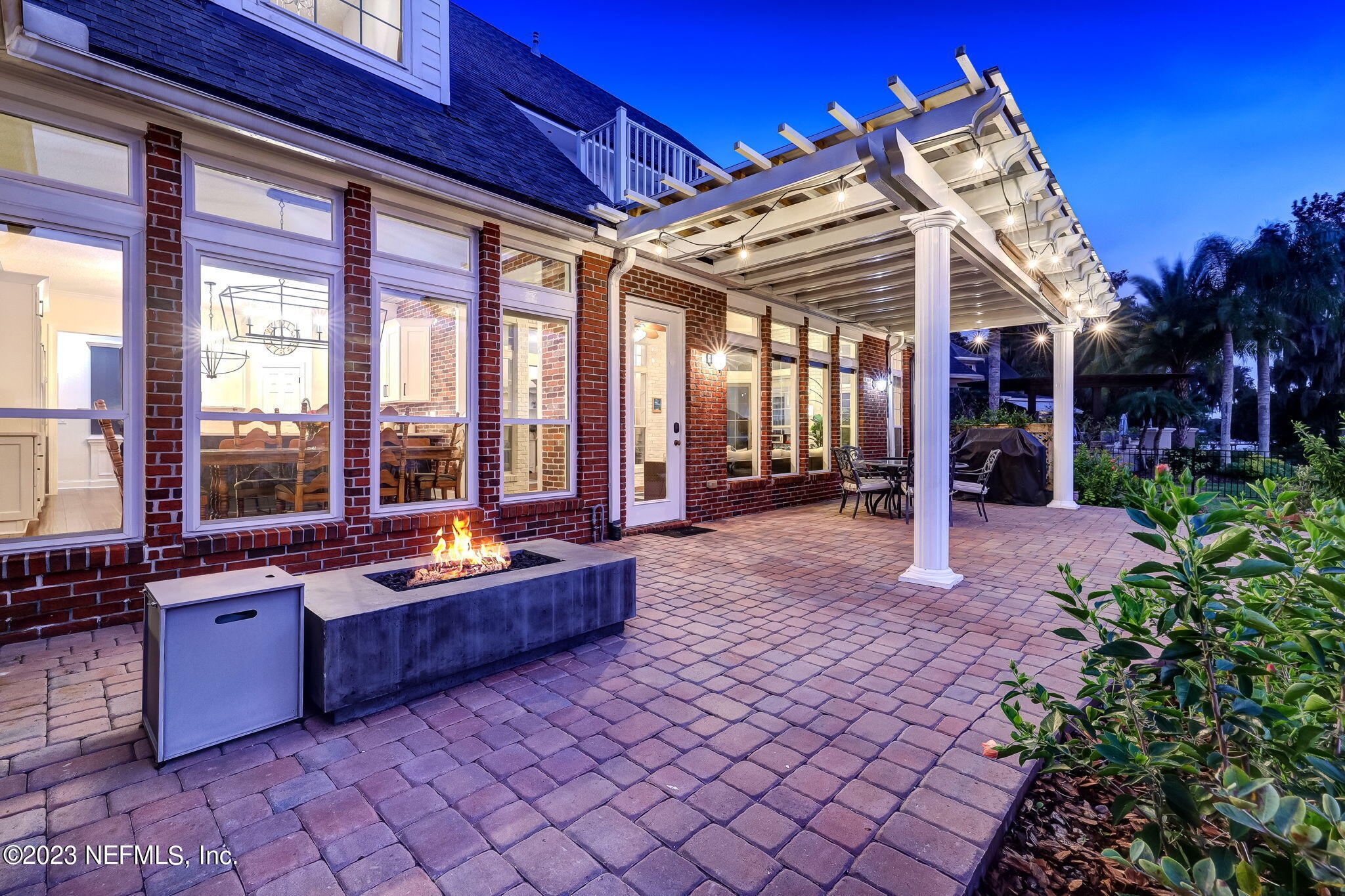 2011 Salt Myrtle Lane Fleming Island, FL 32003 - Photo 90 of 124 a outdoor space with lots of potted plants and glass windows