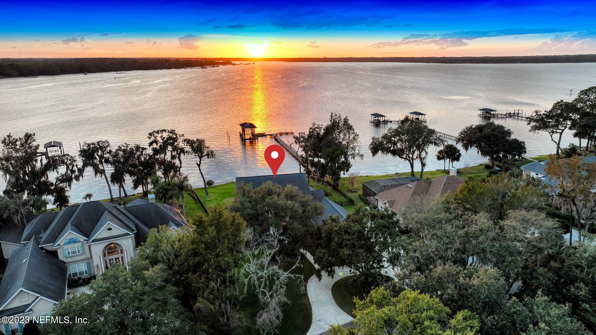 2011 Salt Myrtle Lane Fleming Island, FL 32003 - Photo 93 of 124 a view of a lake with a building in the background