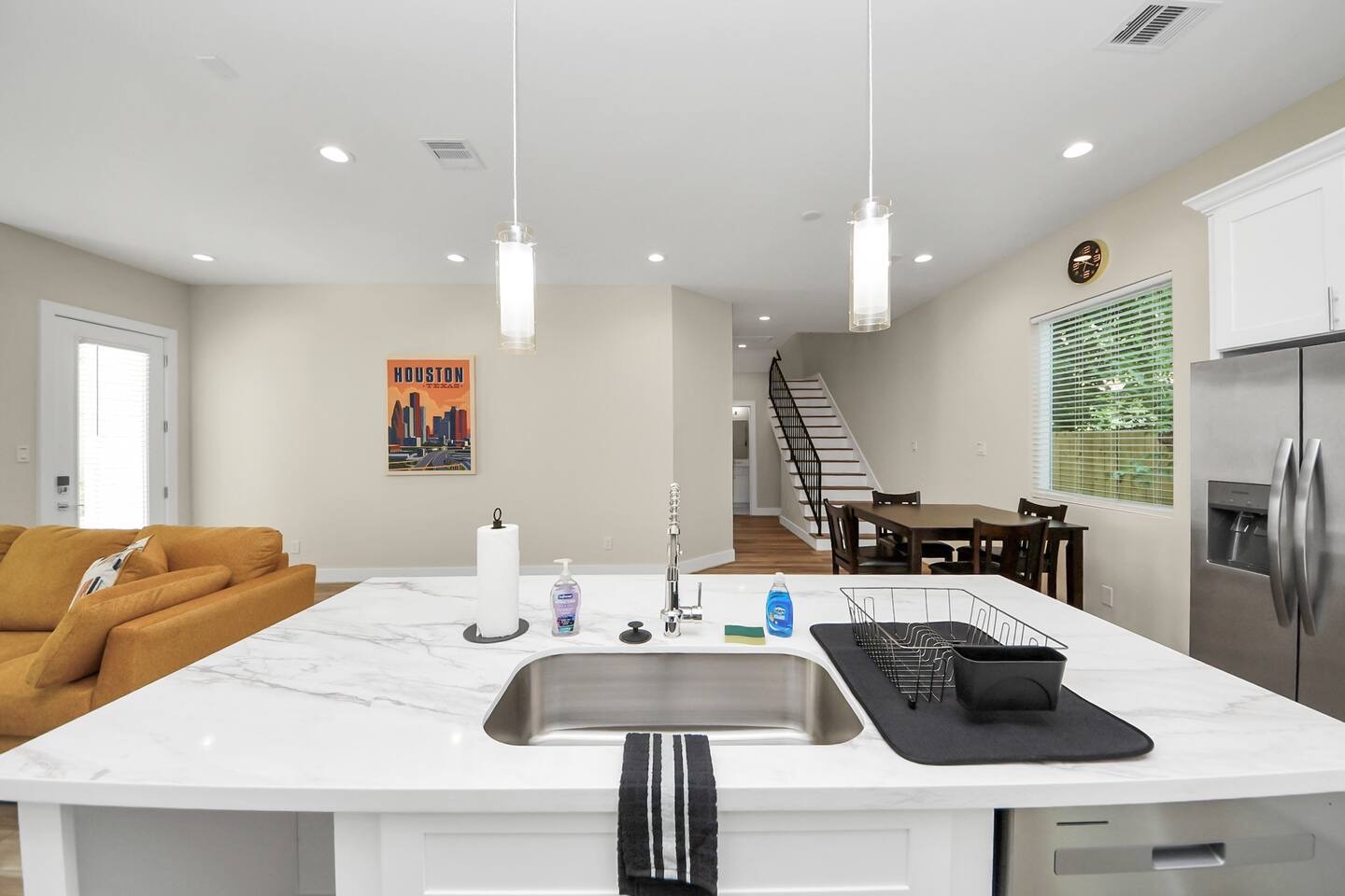 5935 Beall Street, Unit A Houston, TX 77091 - Photo 11 of 50 a kitchen with granite countertop a sink a counter top space and living room view