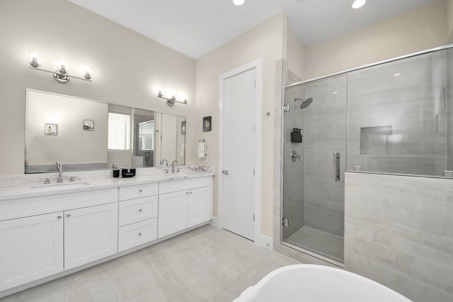 5935 Beall Street, Unit A Houston, TX 77091 - Photo 30 of 50 a bathroom with a double vanity sink toilet mirror and shower