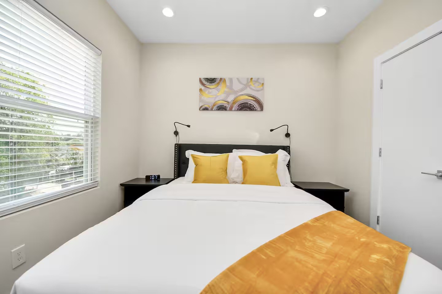 5935 Beall Street, Unit A Houston, TX 77091 - Photo 42 of 50 a bed sitting in a bedroom next to a window