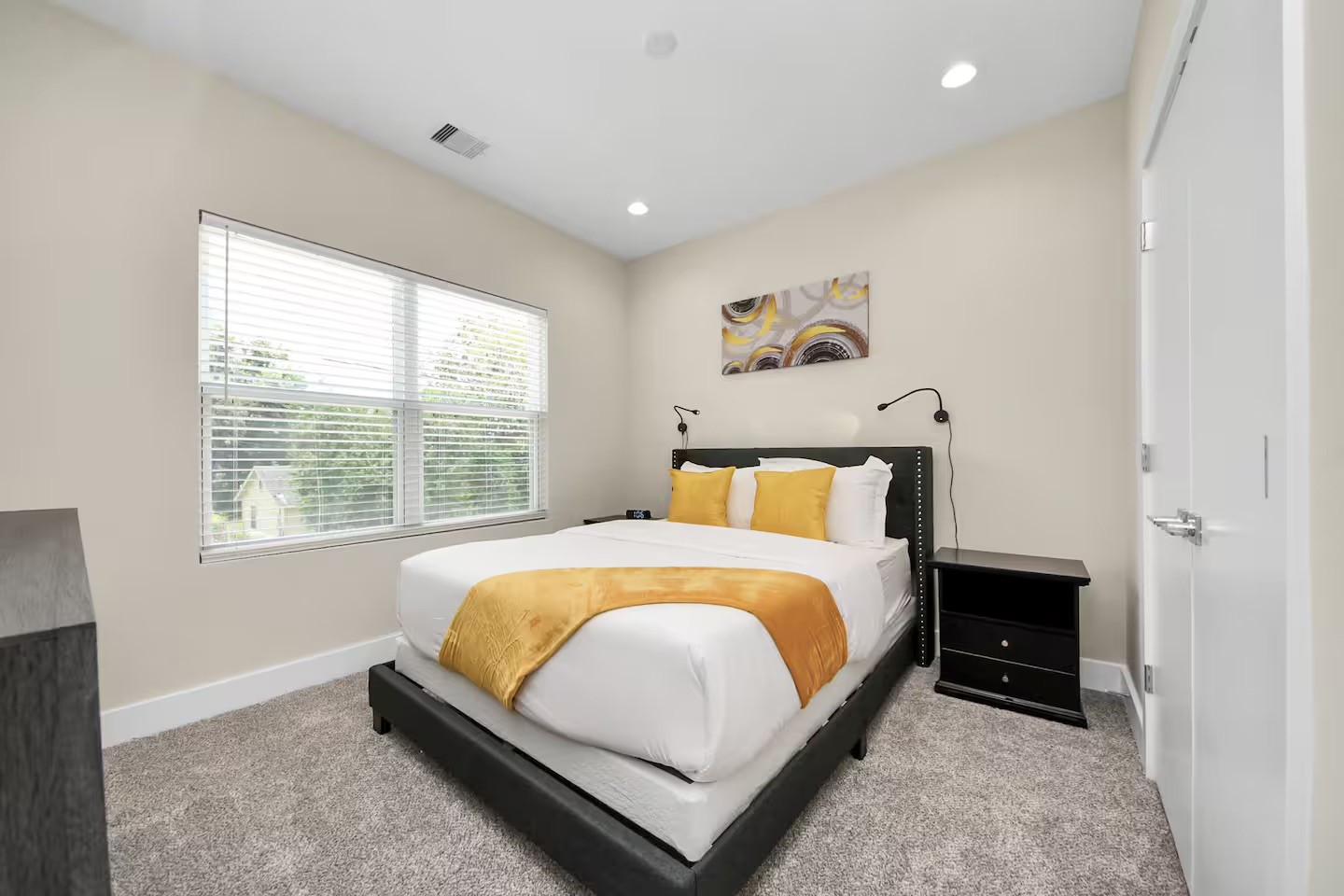 5935 Beall Street, Unit A Houston, TX 77091 - Photo 43 of 50 a bed sitting in a bedroom next to a window