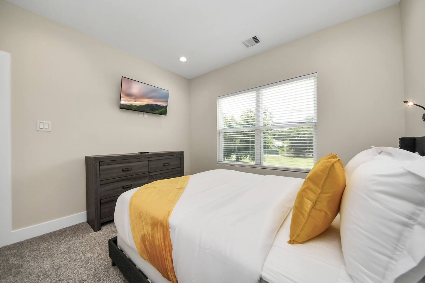 5935 Beall Street, Unit A Houston, TX 77091 - Photo 45 of 50 a bed sitting in a bedroom next to a window