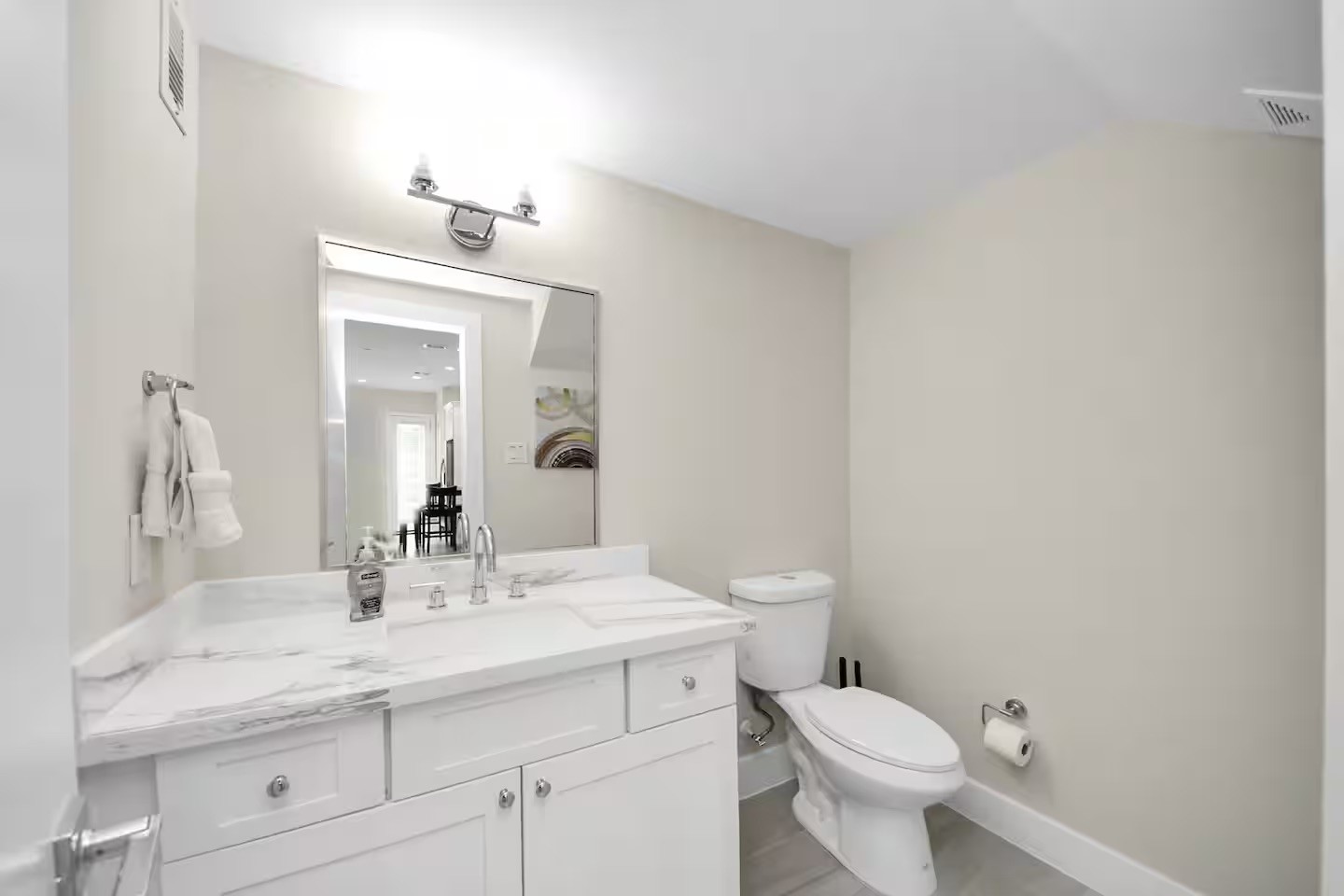 5935 Beall Street, Unit A Houston, TX 77091 - Photo 47 of 50 a bathroom with a toilet a sink and mirror