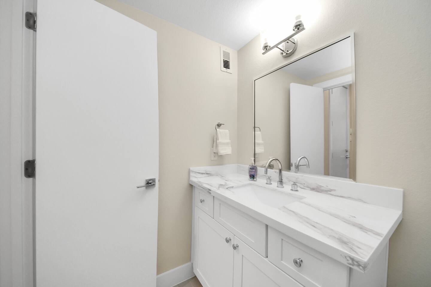 5935 Beall Street, Unit A Houston, TX 77091 - Photo 49 of 50 a bathroom with a sink and a mirror