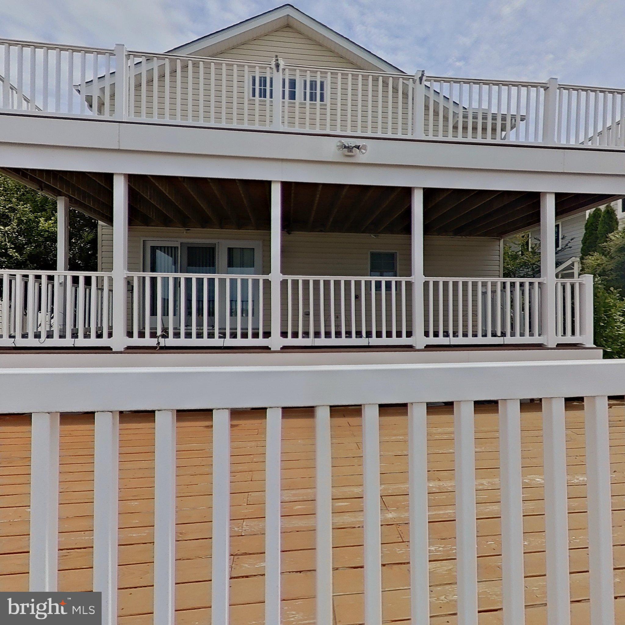 505 South Surf Road Ocean City, MD 21842 - Photo 15 of 49 a view of a white building with a window