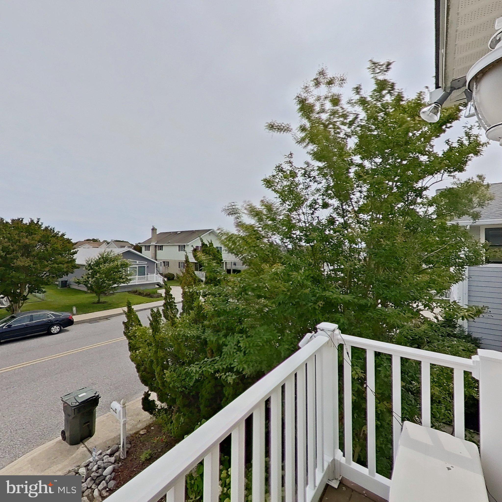 505 South Surf Road Ocean City, MD 21842 - Photo 16 of 49 a balcony with an outdoor space