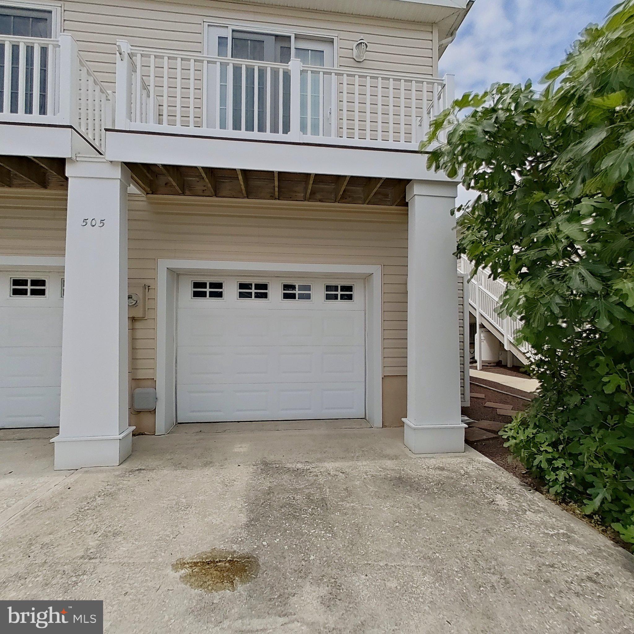 505 South Surf Road Ocean City, MD 21842 - Photo 18 of 49 a view of a small house with wooden wall