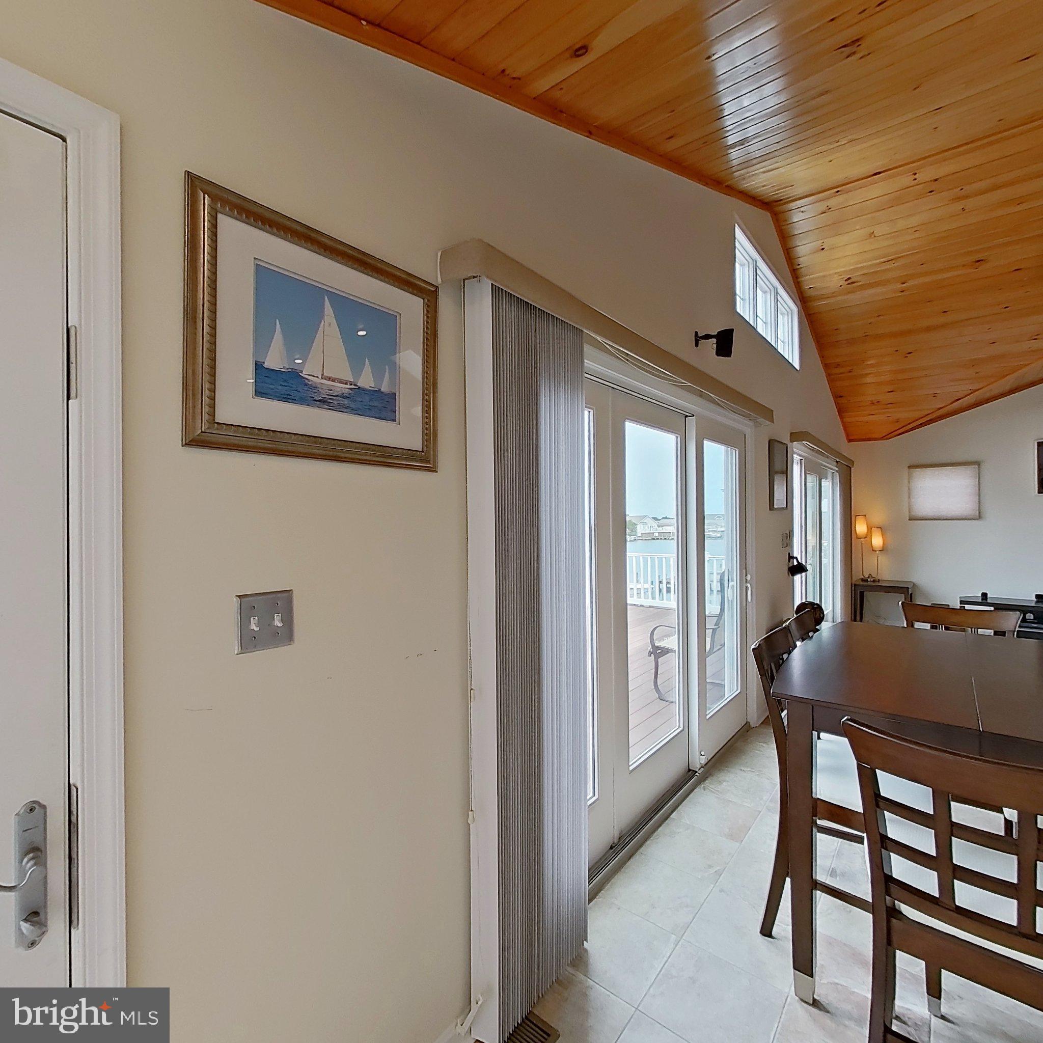 505 South Surf Road Ocean City, MD 21842 - Photo 19 of 49 a dining room with furniture and window