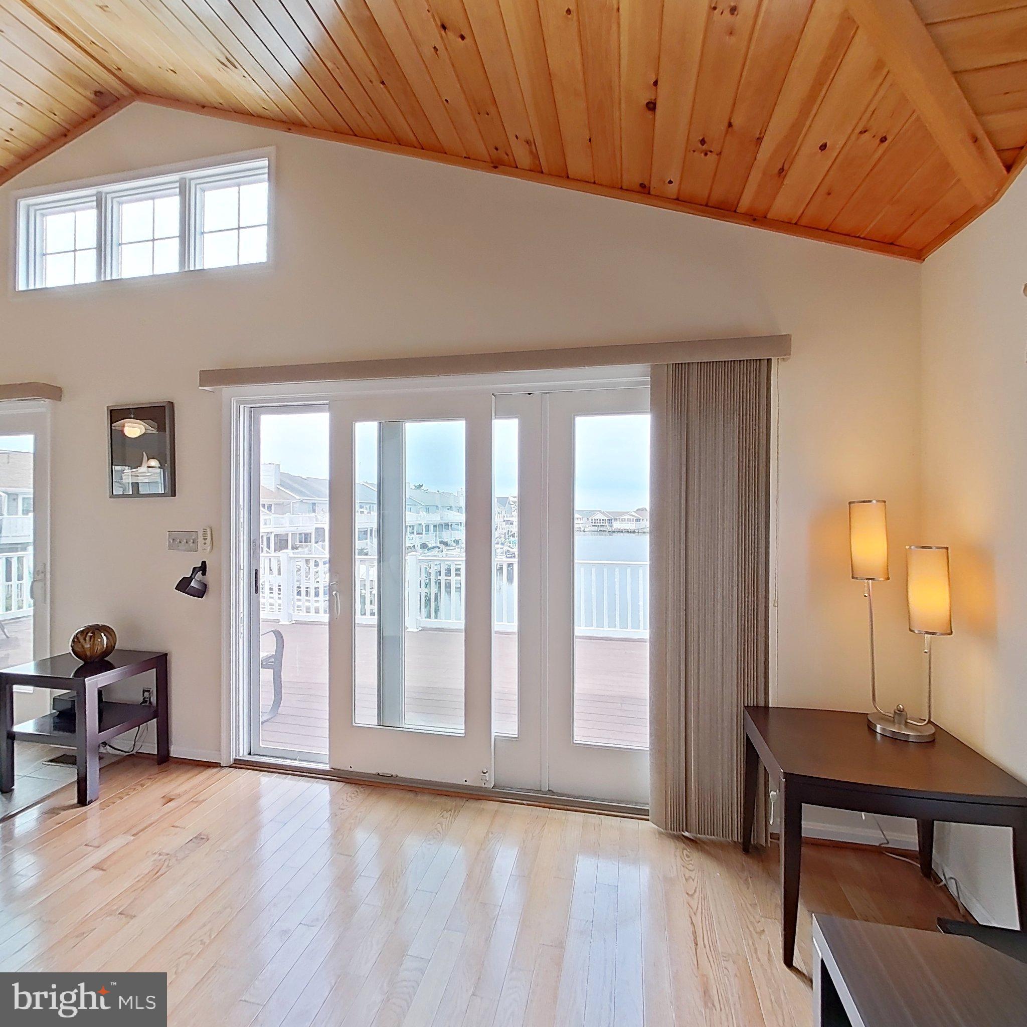 505 South Surf Road Ocean City, MD 21842 - Photo 25 of 49 a view of a livingroom with furniture and a window