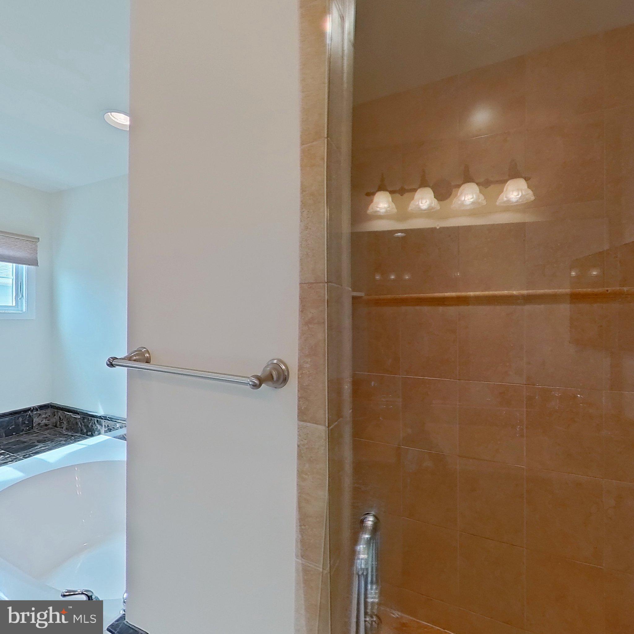 505 South Surf Road Ocean City, MD 21842 - Photo 33 of 49 a bathroom with a shower