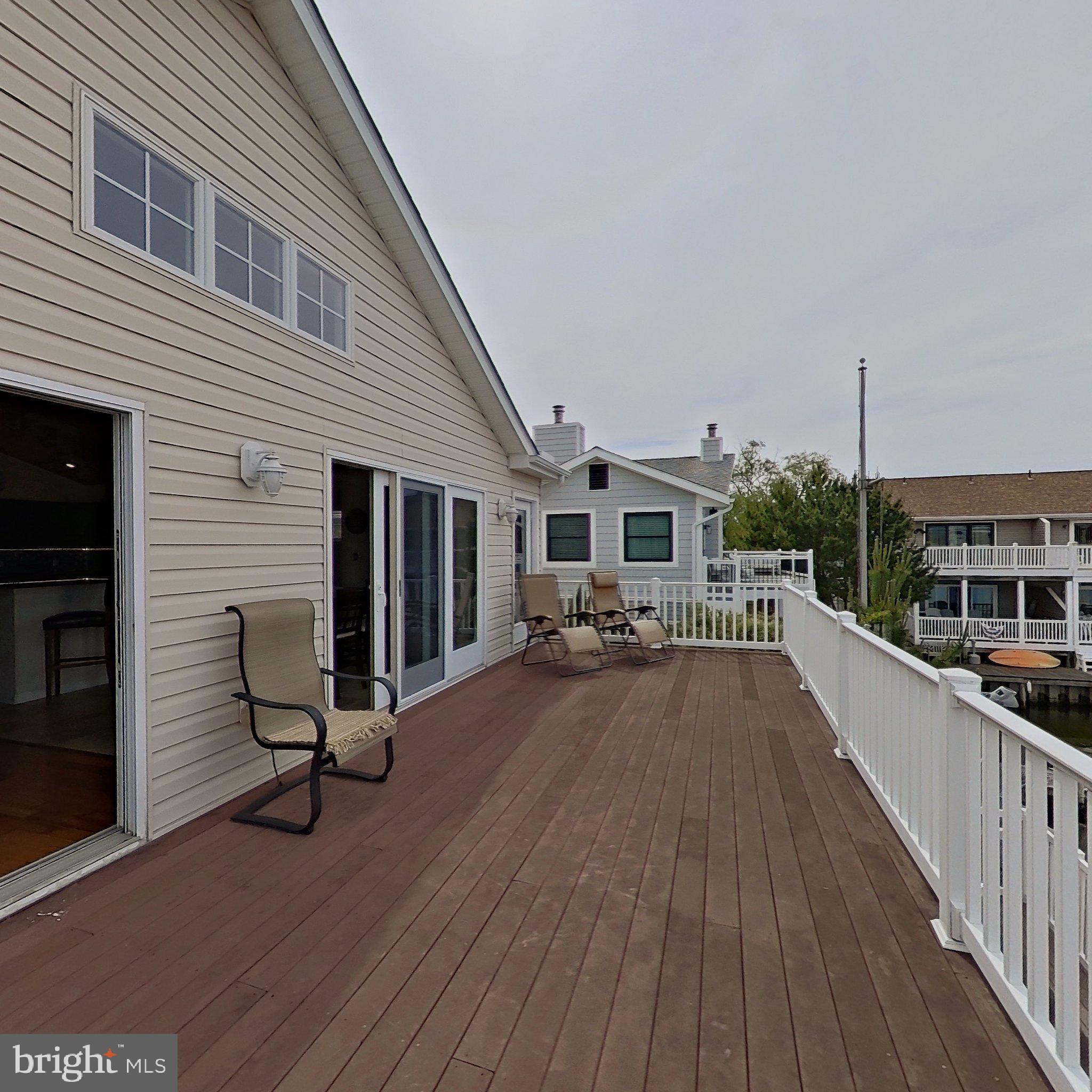 505 South Surf Road Ocean City, MD 21842 - Photo 40 of 49 a view of a house with pool and wooden deck