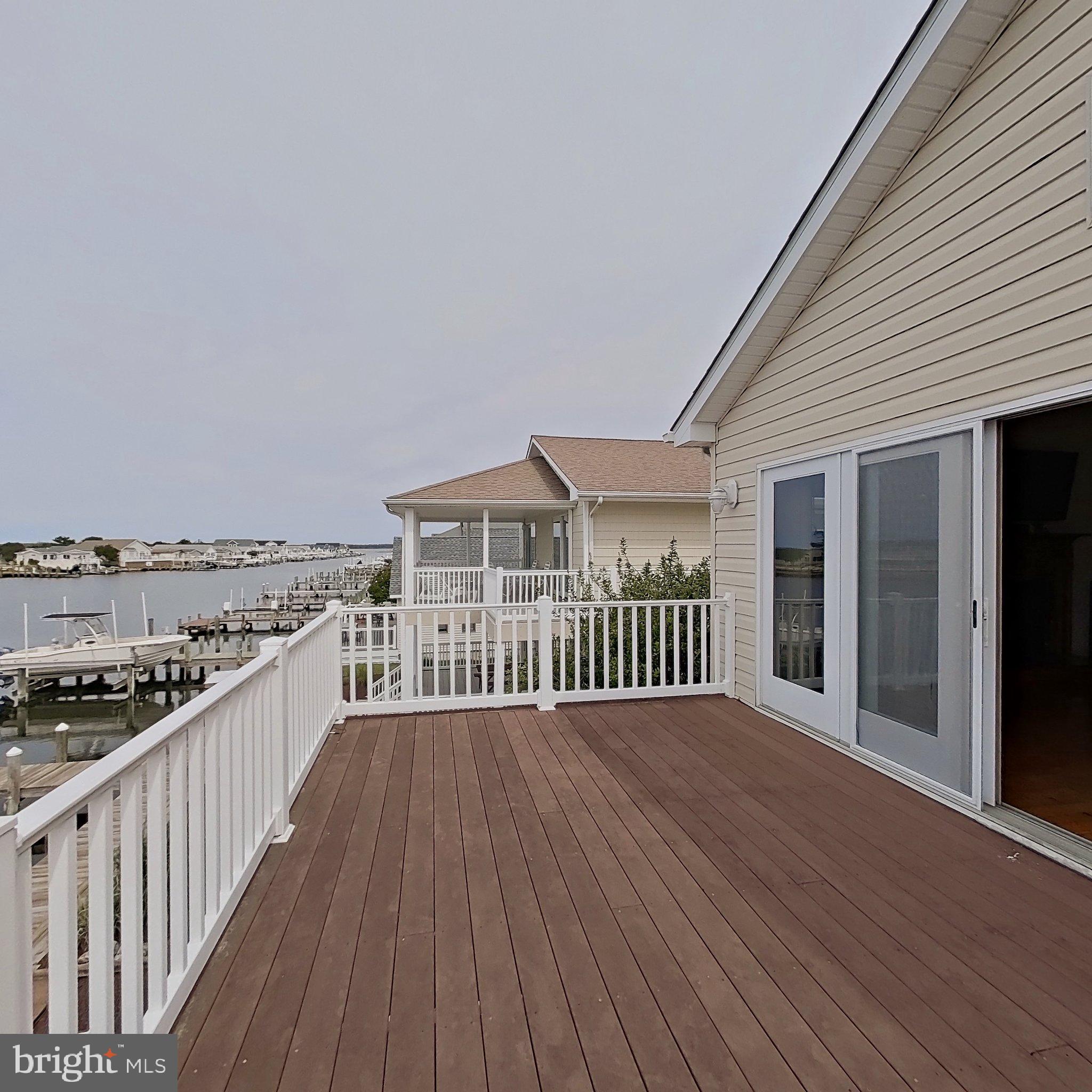 505 South Surf Road Ocean City, MD 21842 - Photo 41 of 49 a view of a balcony with wooden floor