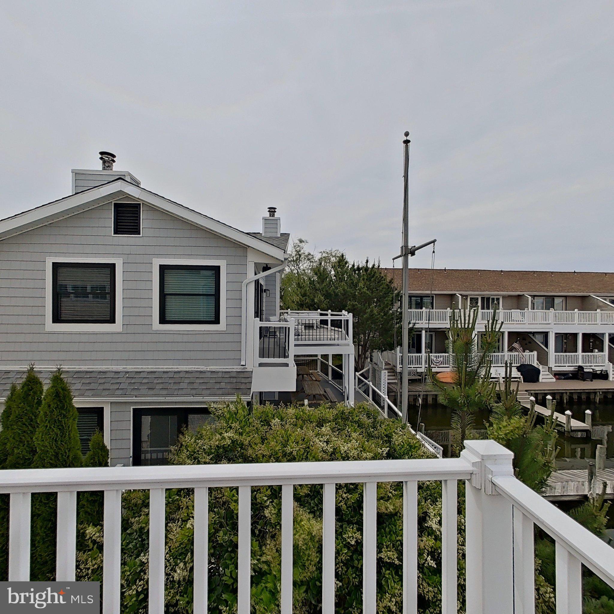 505 South Surf Road Ocean City, MD 21842 - Photo 45 of 49 a front view of a house with plants
