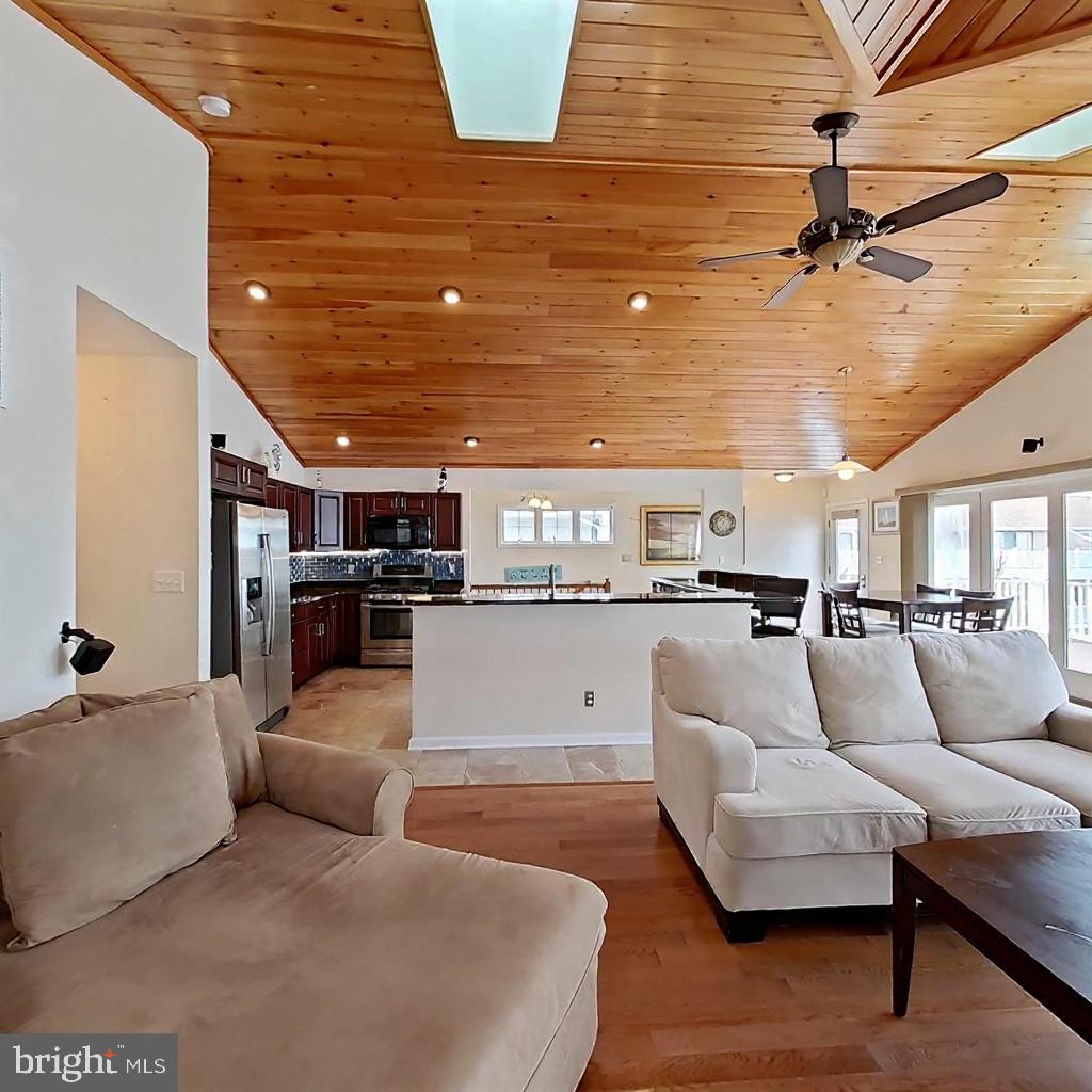 505 South Surf Road Ocean City, MD 21842 - Photo 10 of 49 a living room with furniture and a view of kitchen