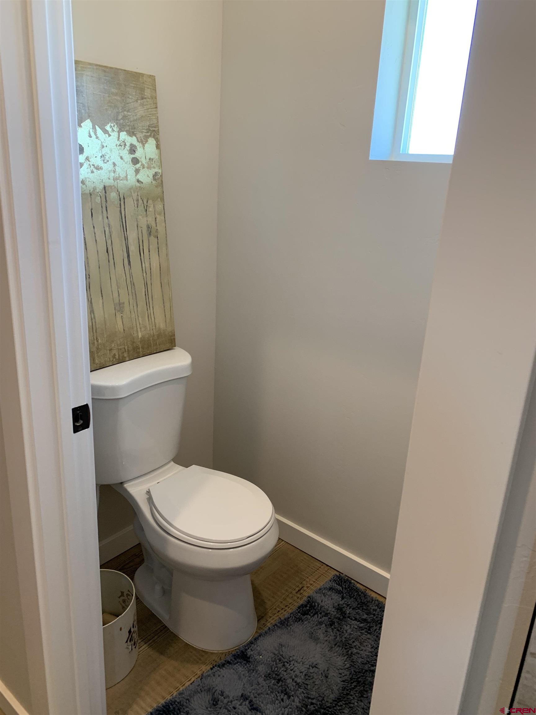 10400 Road 23.5 Cortez, CO 81321 - Photo 18 of 34 a white toilet sitting next to a shower