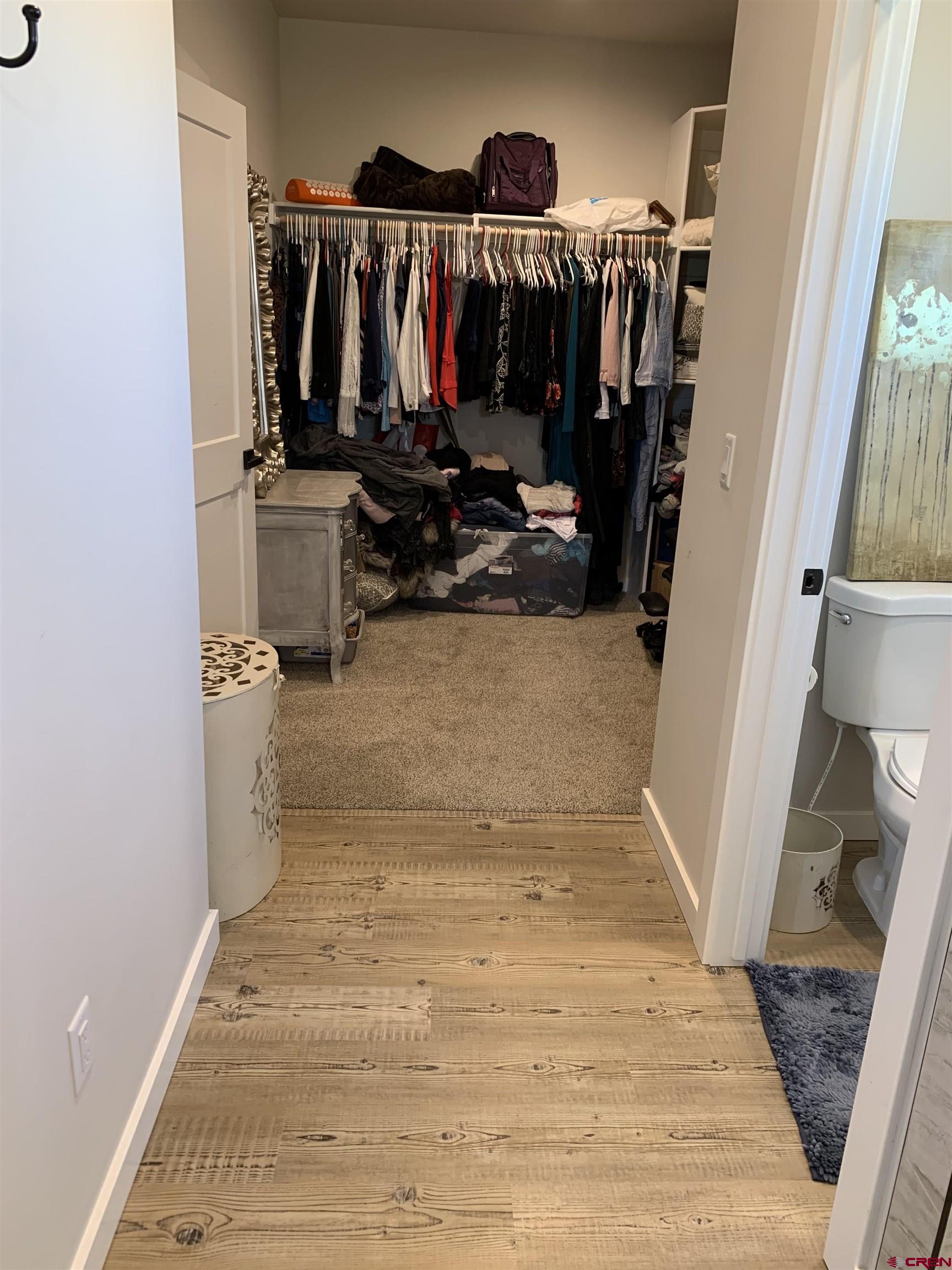 10400 Road 23.5 Cortez, CO 81321 - Photo 19 of 34 a view of walk in closet with clothes and shoes