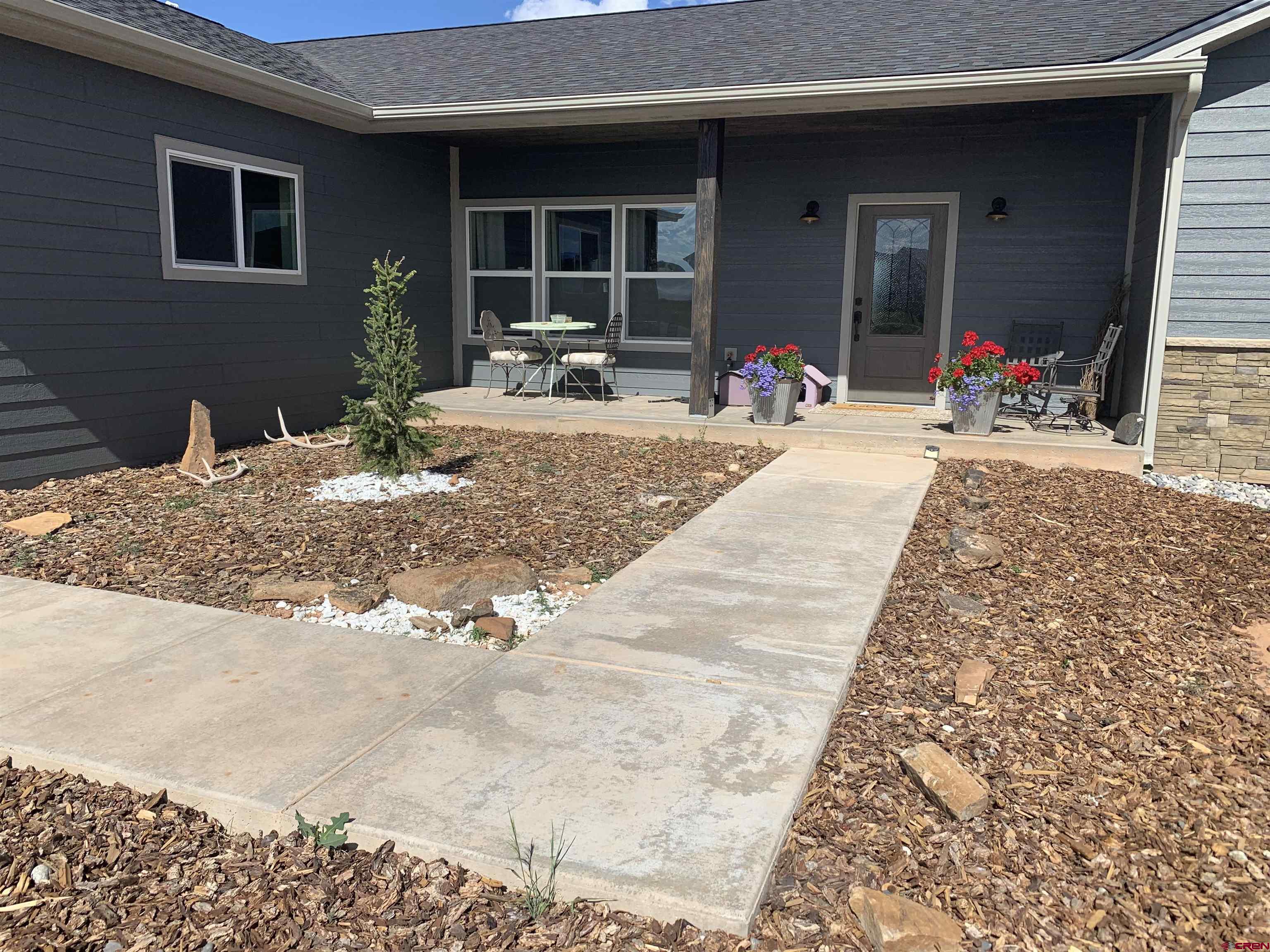 10400 Road 23.5 Cortez, CO 81321 - Photo 2 of 34 a view of the porch of the house
