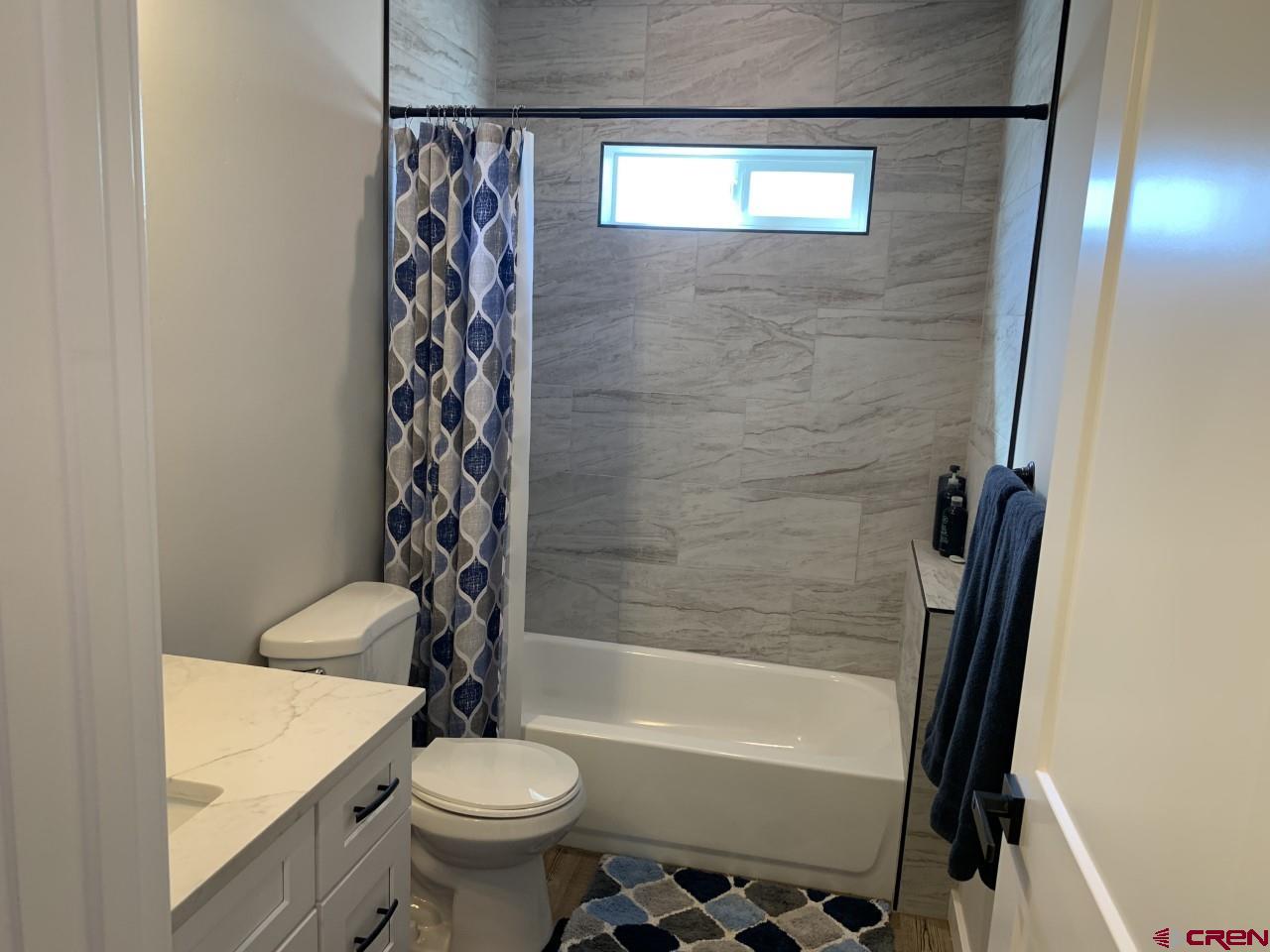 10400 Road 23.5 Cortez, CO 81321 - Photo 22 of 34 a bathroom with a sink a toilet and shower