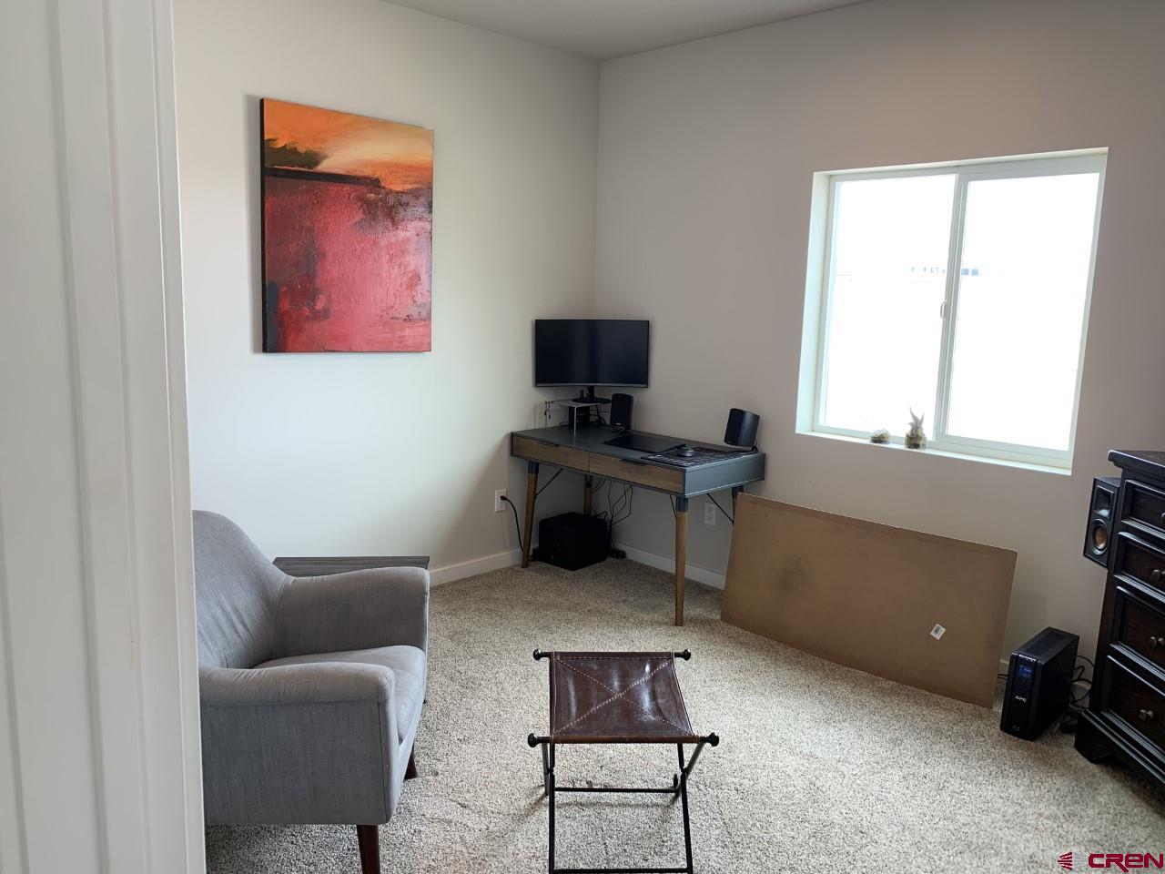 10400 Road 23.5 Cortez, CO 81321 - Photo 23 of 34 a living room with furniture and a window