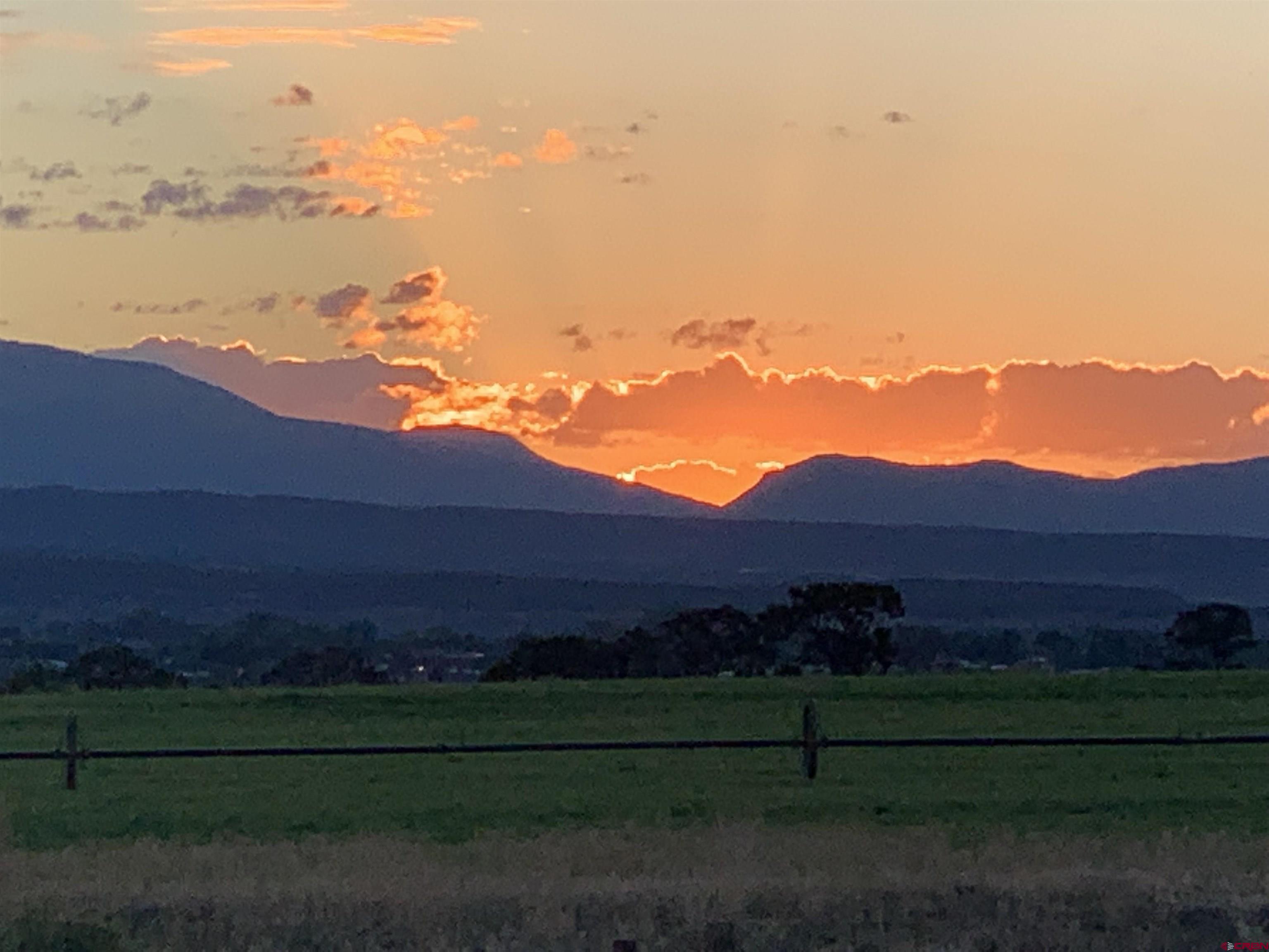 10400 Road 23.5 Cortez, CO 81321 - Photo 27 of 34 a view of a grassy area with sunset view