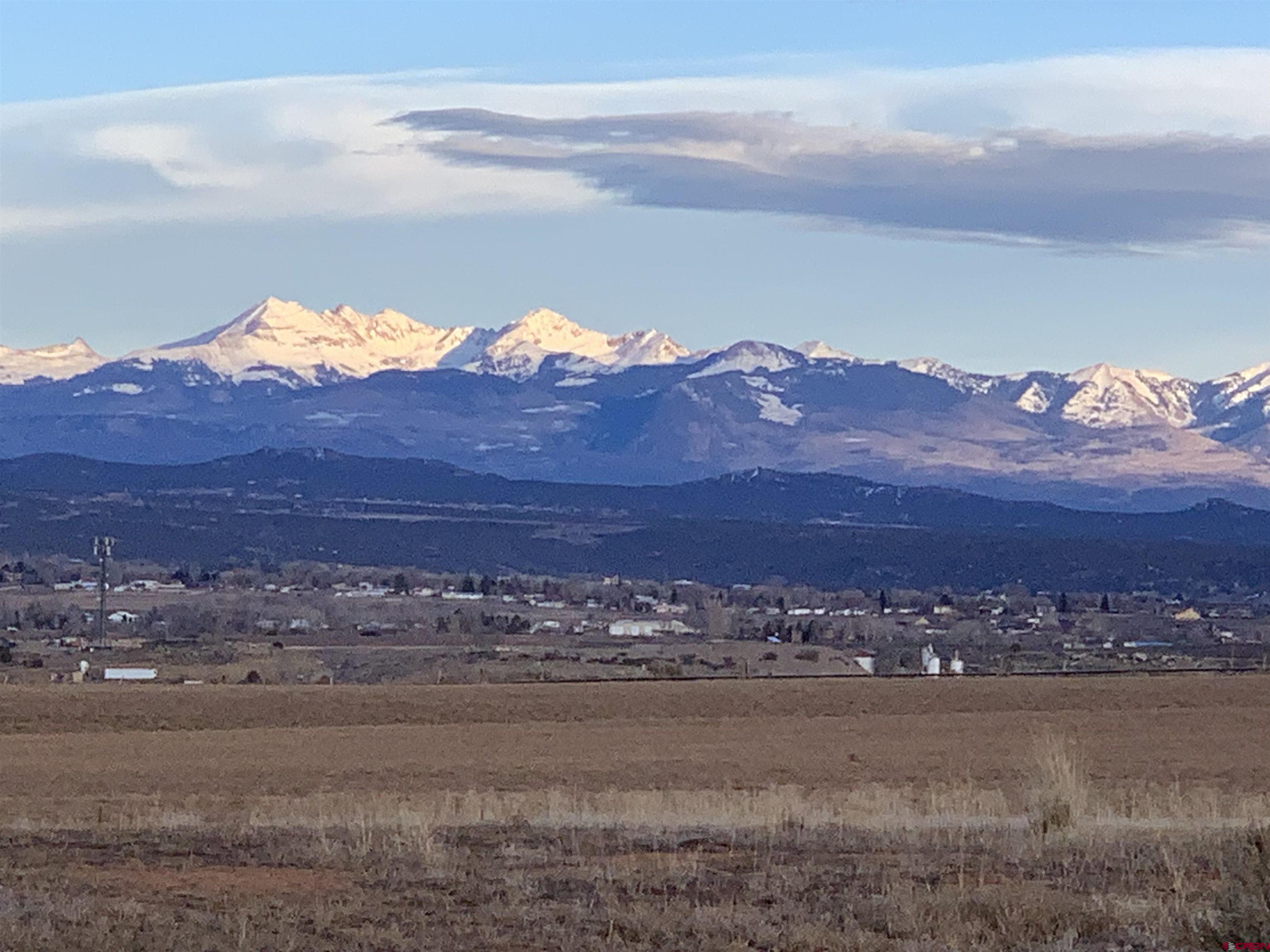 10400 Road 23.5 Cortez, CO 81321 - Photo 32 of 34 a view of a lake with sunset in background