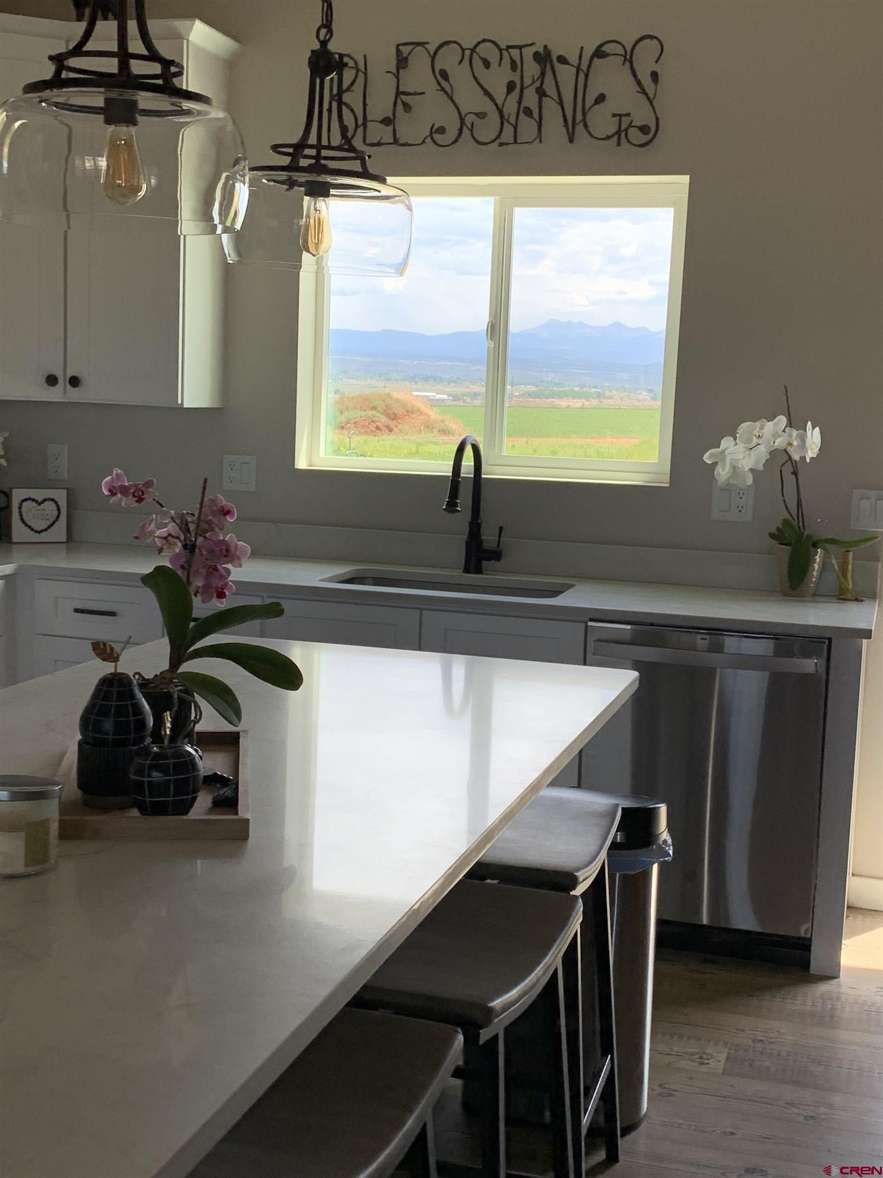 10400 Road 23.5 Cortez, CO 81321 - Photo 7 of 34 a kitchen with a sink a counter and a window