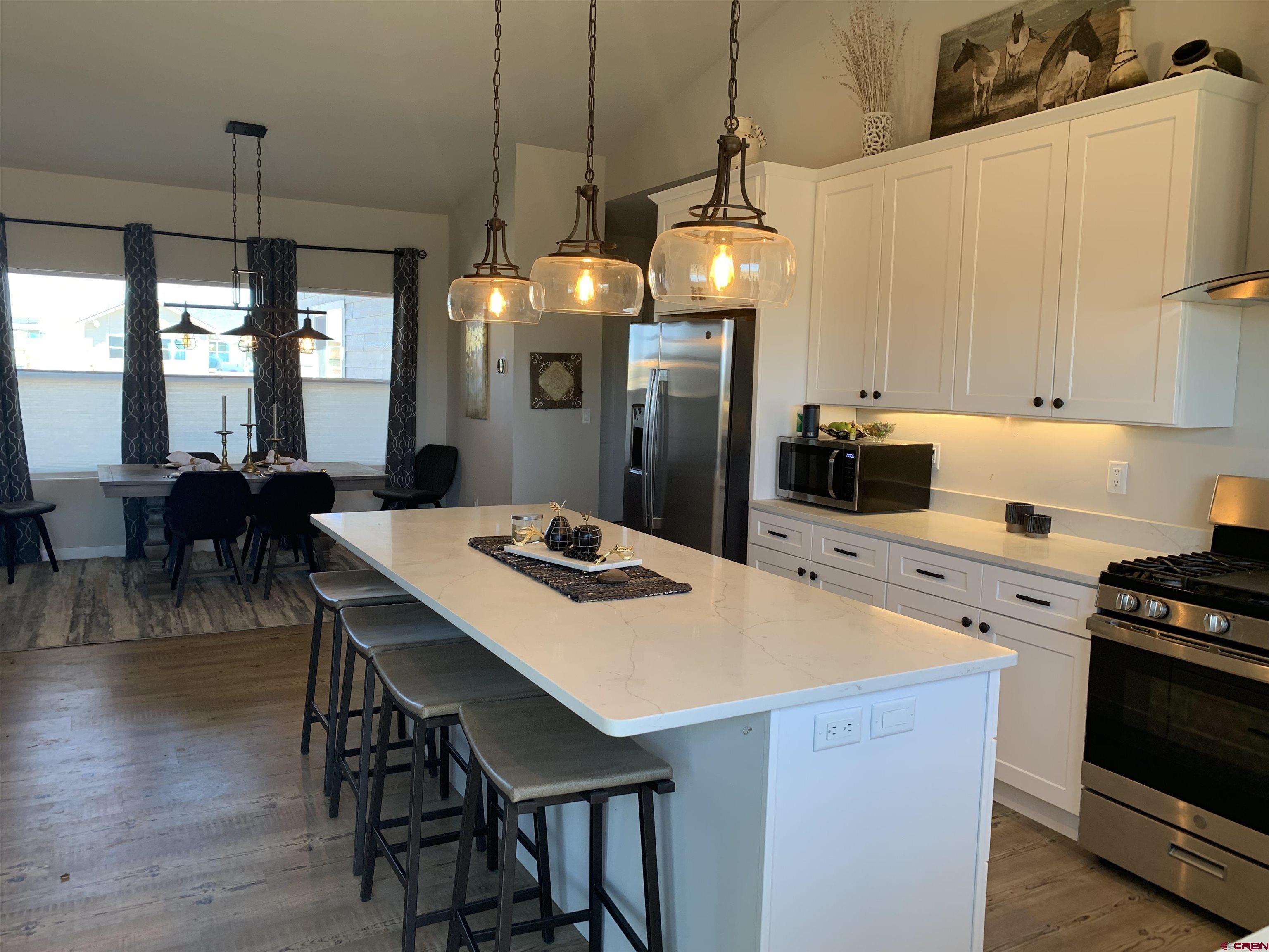 10400 Road 23.5 Cortez, CO 81321 - Photo 9 of 34 a kitchen that has a cabinets a sink and a stove