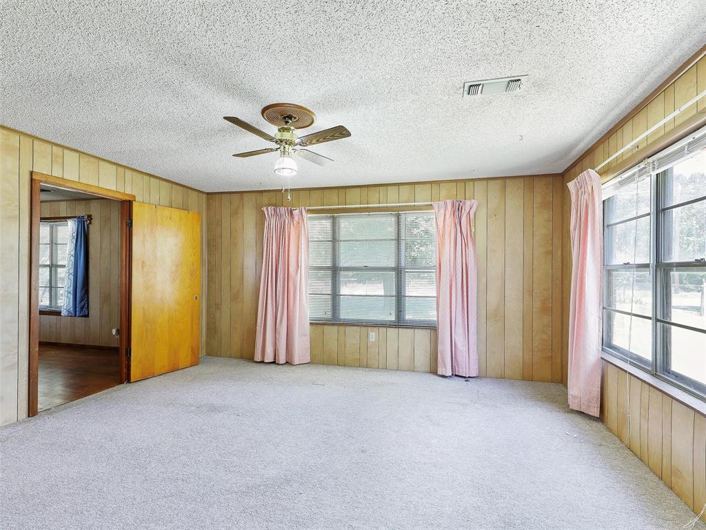 404 Selma Road Bowie, TX 76230 - Photo 15 of 21 a view of an empty room with a window