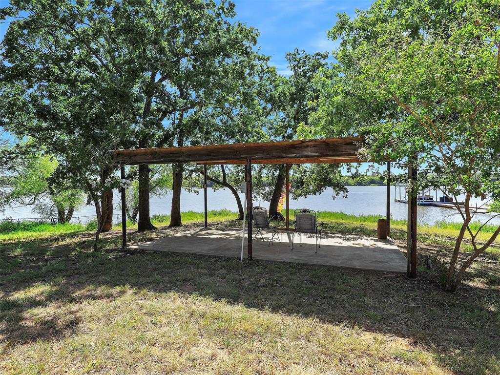 404 Selma Road Bowie, TX 76230 - Photo 20 of 21 a view of a yard with porch