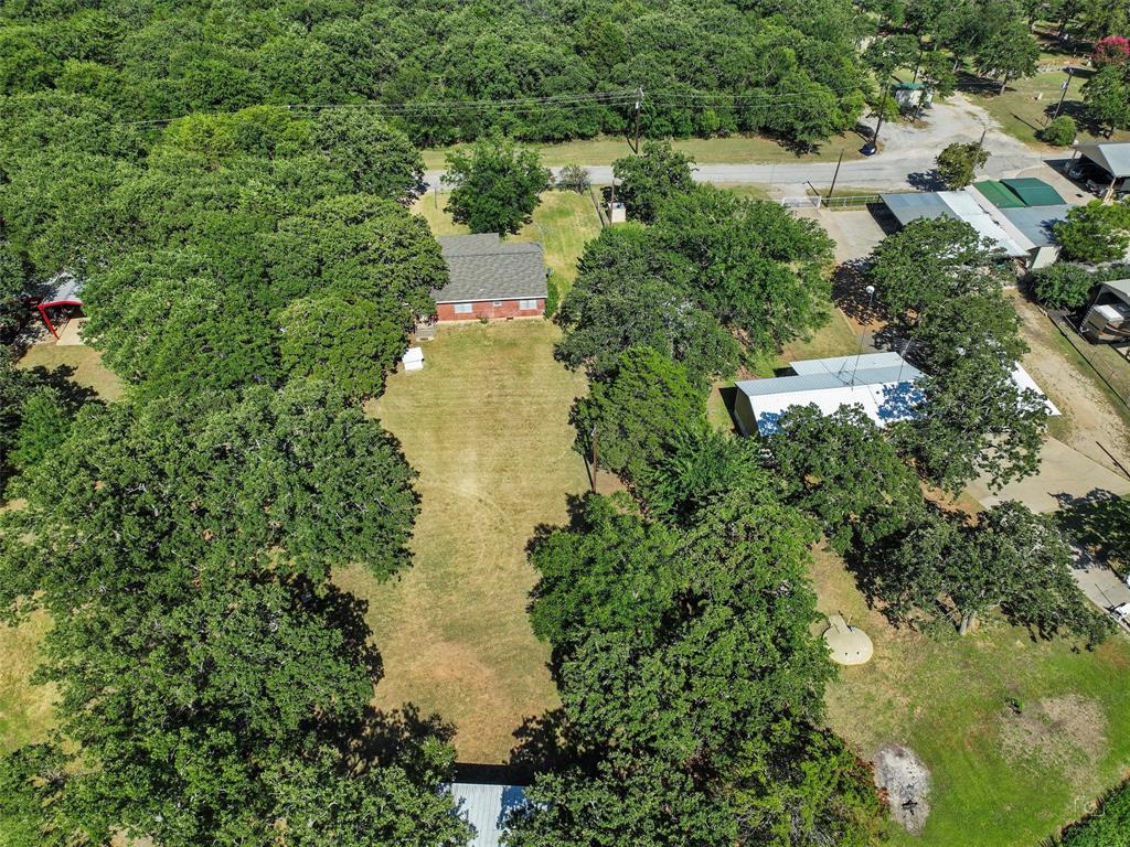 404 Selma Road Bowie, TX 76230 - Photo 8 of 21 a aerial view of a house with a yard and lake view