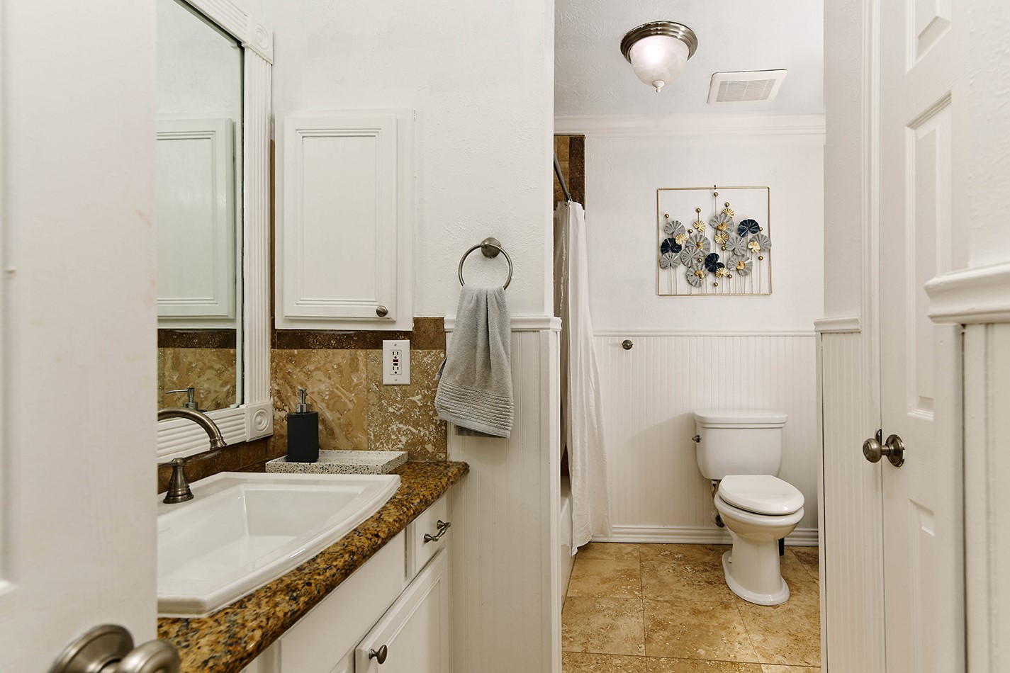 18834 Forest Elms Drive Spring, TX 77388 - Photo 31 of 47 a bathroom with a granite countertop sink toilet and shower