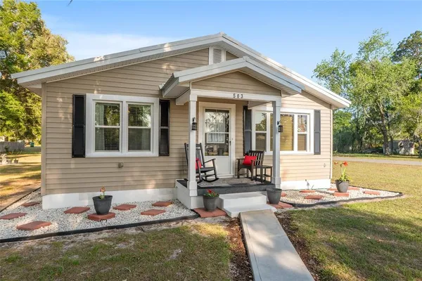 a front view of a house with entertaining space