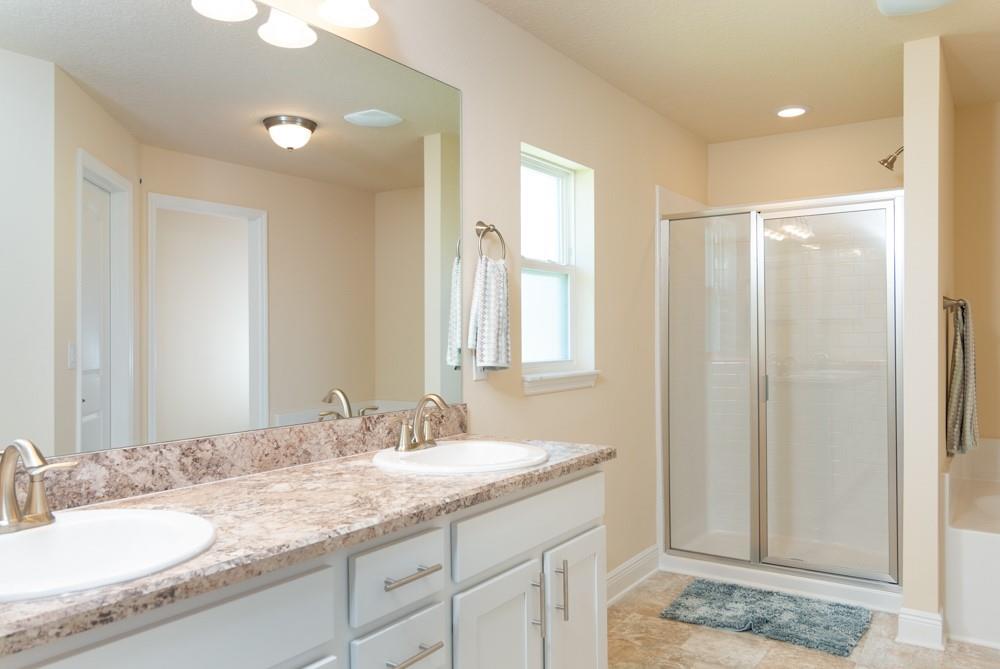 1391 Seahouse Street Sebastian, FL 32958 - Photo 2 of 18 a bathroom with a granite countertop sink and a mirror