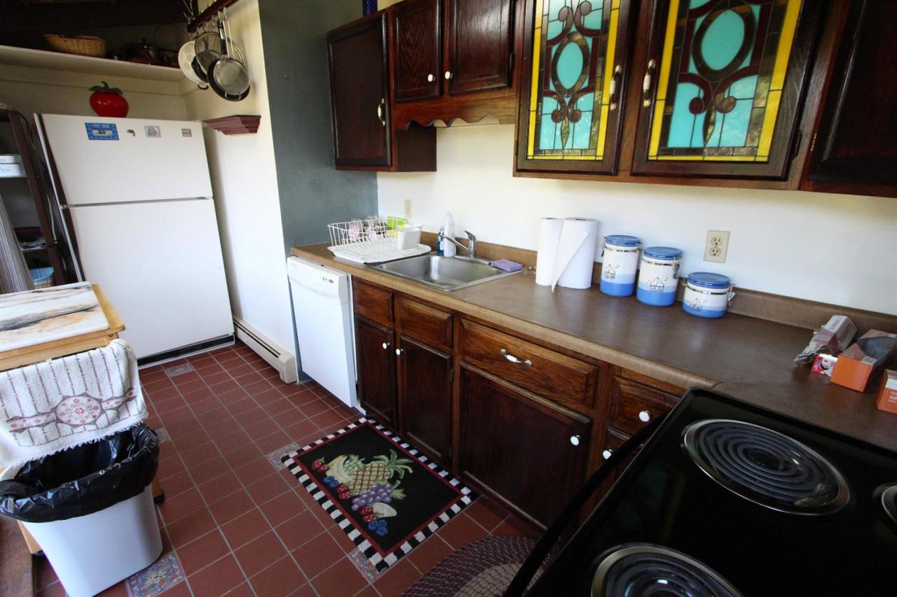 34 Twine Field Road Truro, MA 02666 - Photo 4 of 24 a kitchen with a sink stove and refrigerator