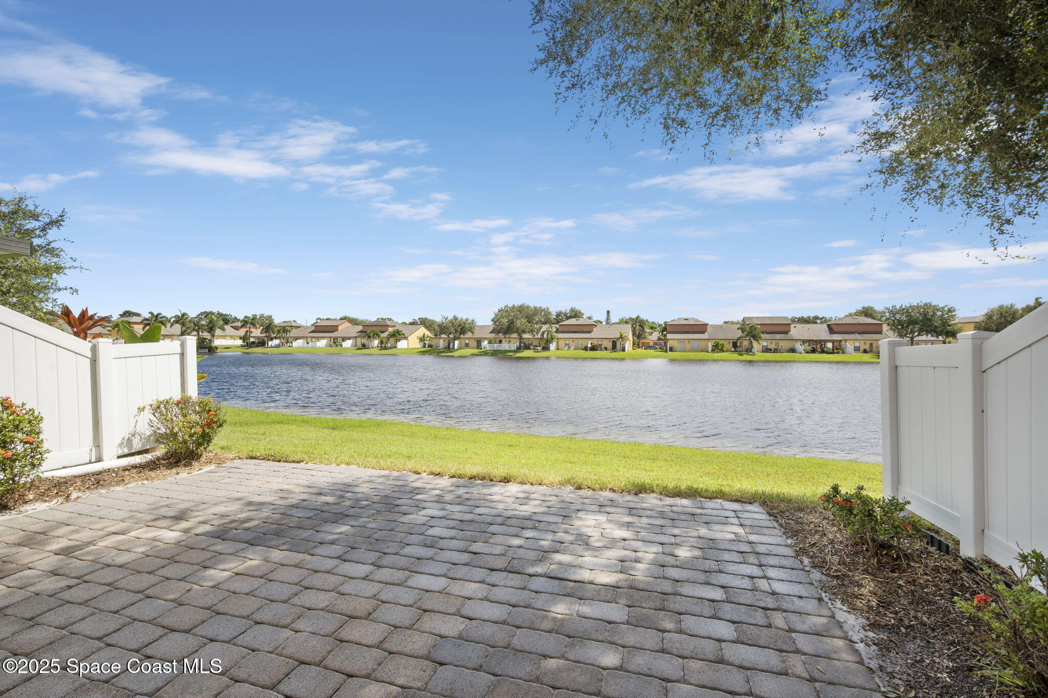 4575 Radiant Way, Unit 102 Melbourne, FL 32901 - Photo 14 of 52 a view of a city with lawn chairs